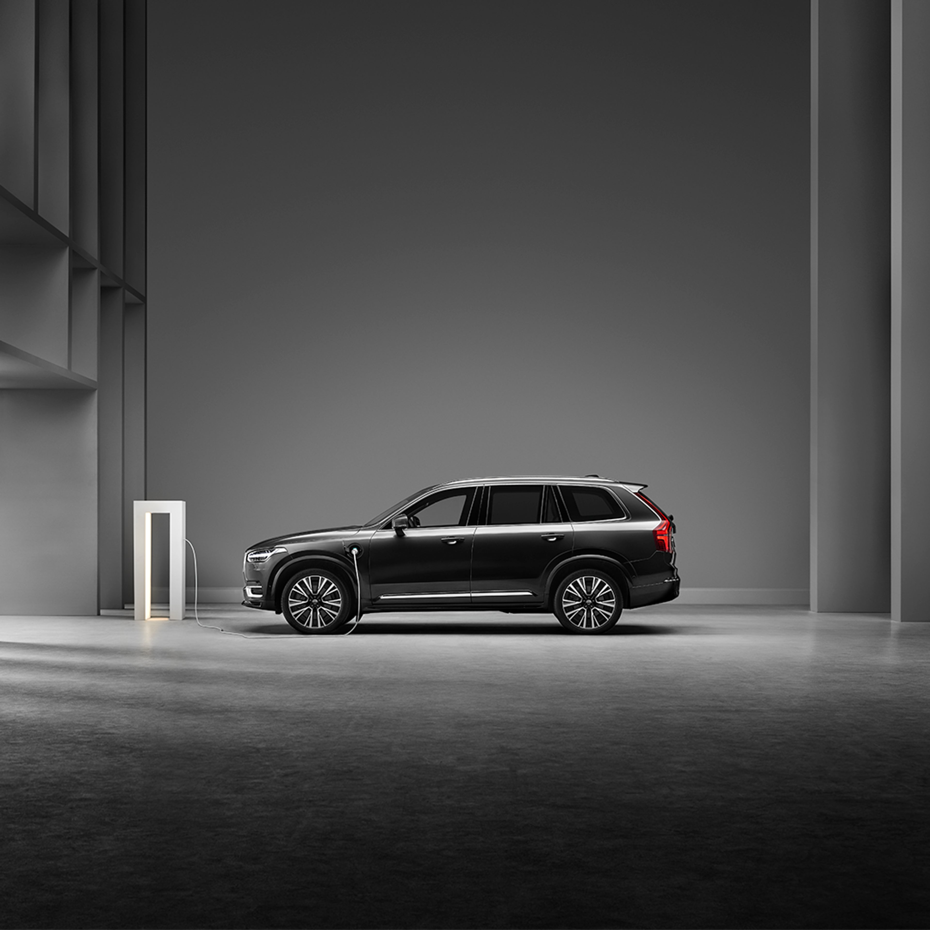 The heavy-armoured Volvo XC90 and the light-armoured XC90 and XC60 parked outside an official building.