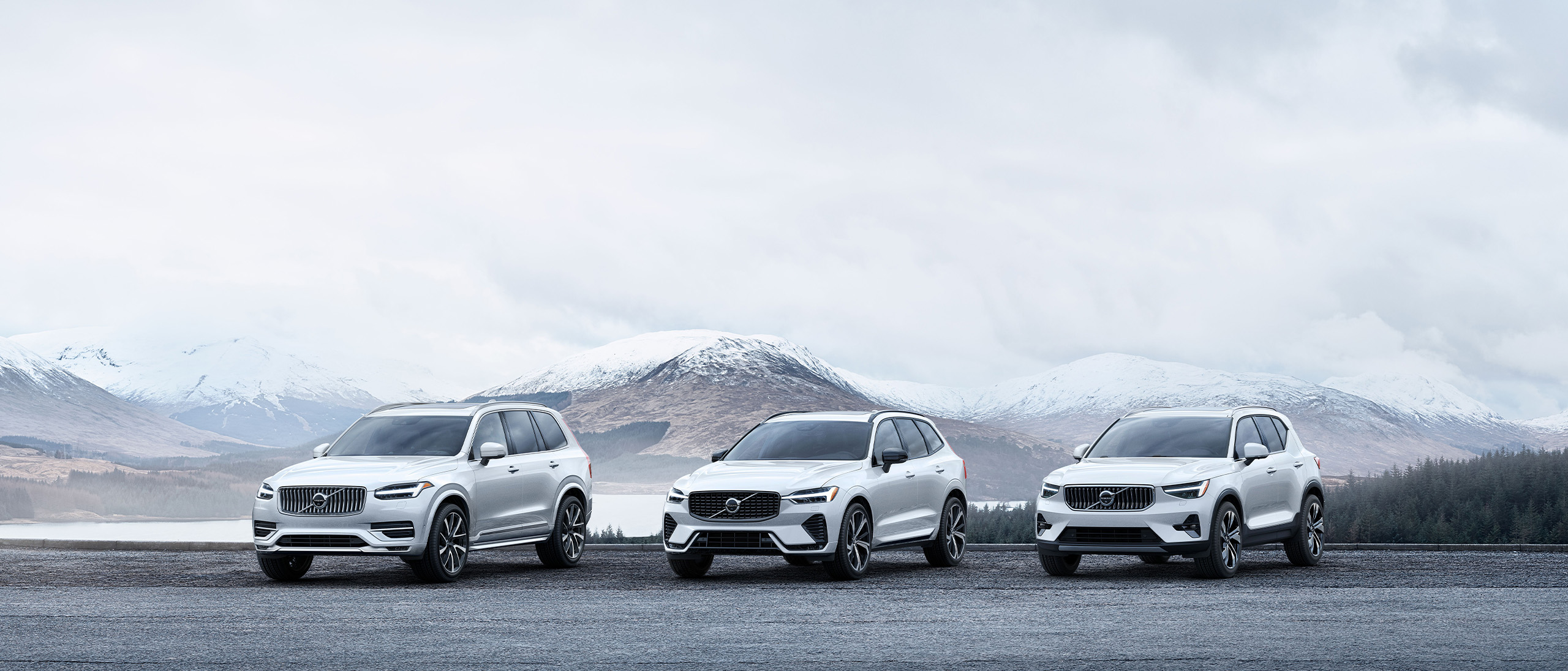 Volvo Mild Hybrid SUV Range parked in front of snowy mountains 