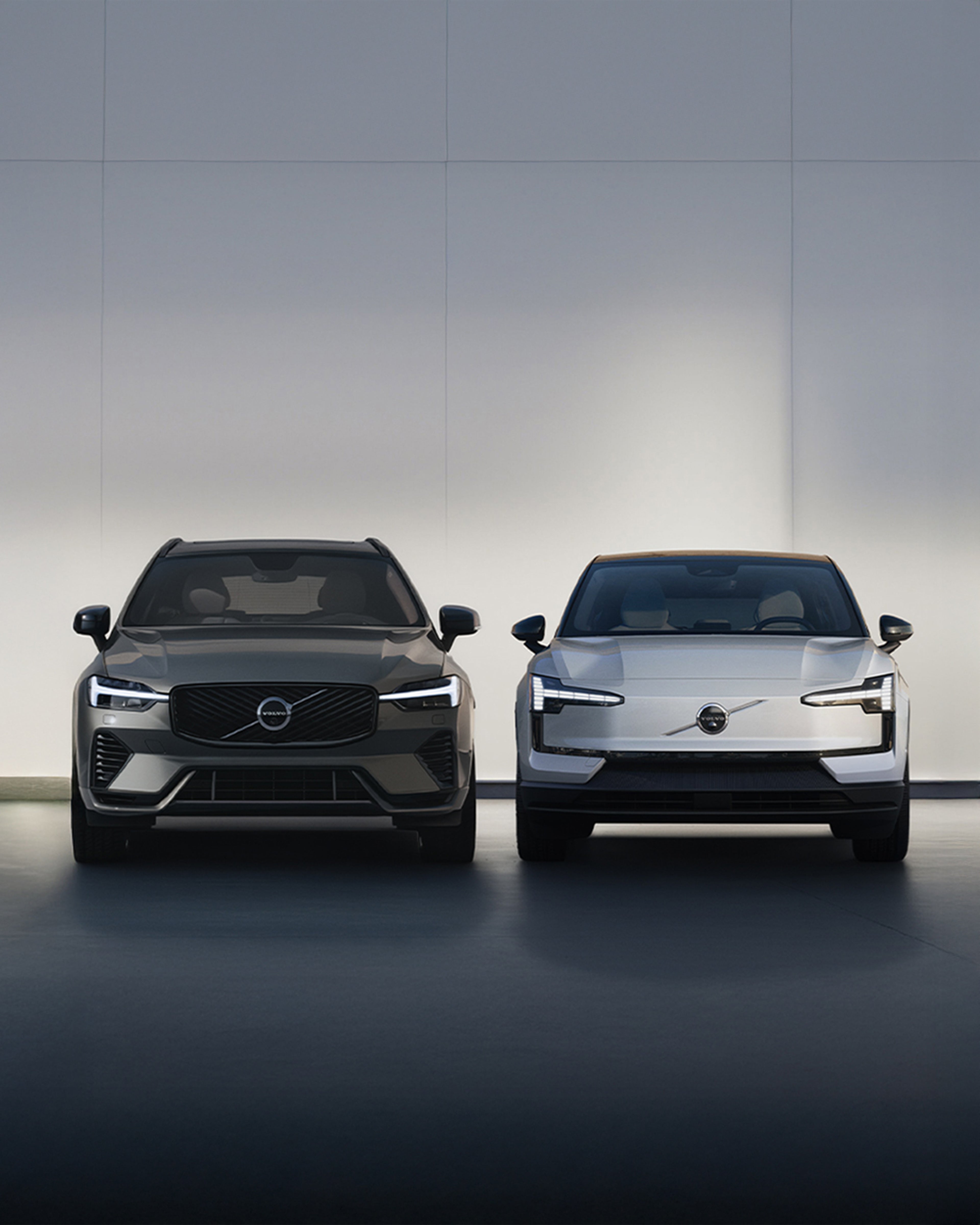 Front view of the fully electric Volvo EX90 SUV in Vapour Grey charging.