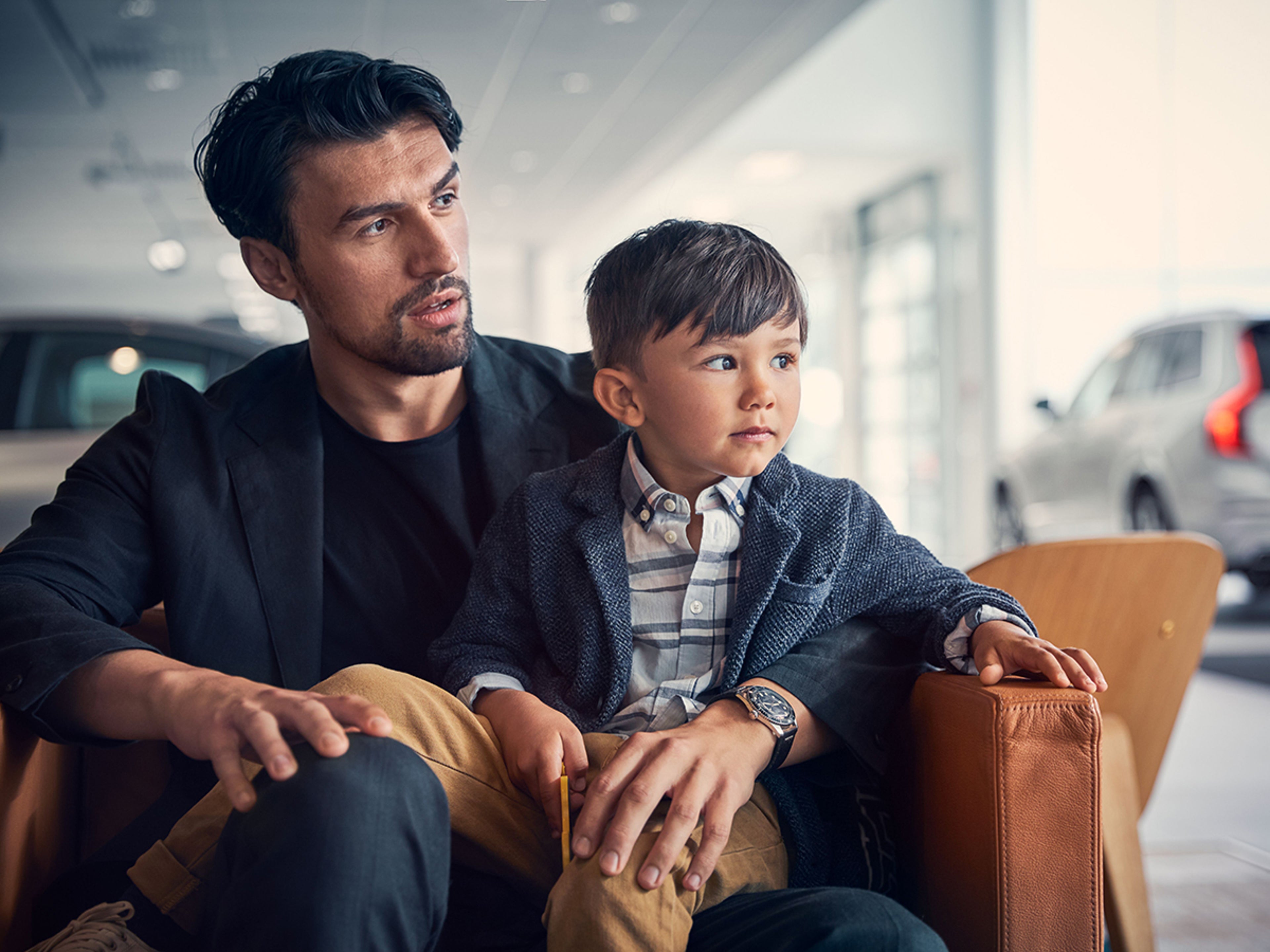Arrival in Sweden - Volvo Overseas Delivery - Man and boy sitting