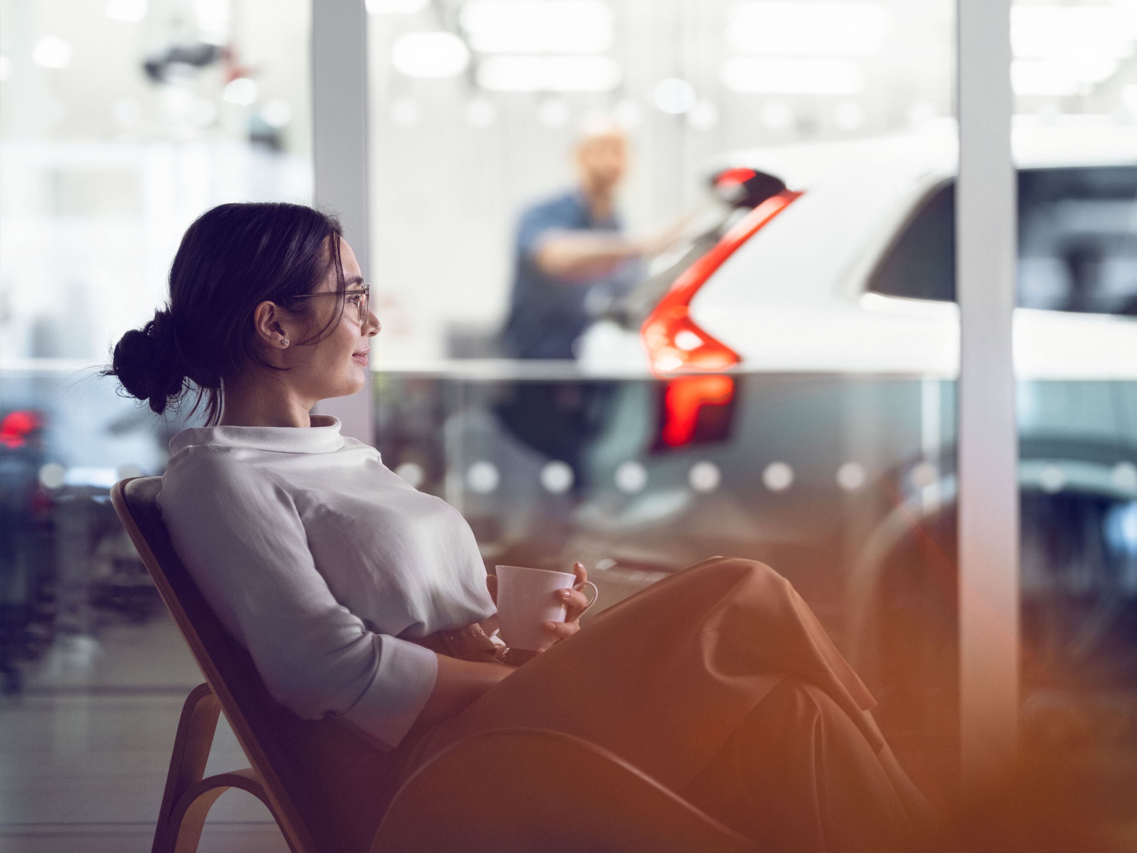 A Volvo customer waits in the lounge