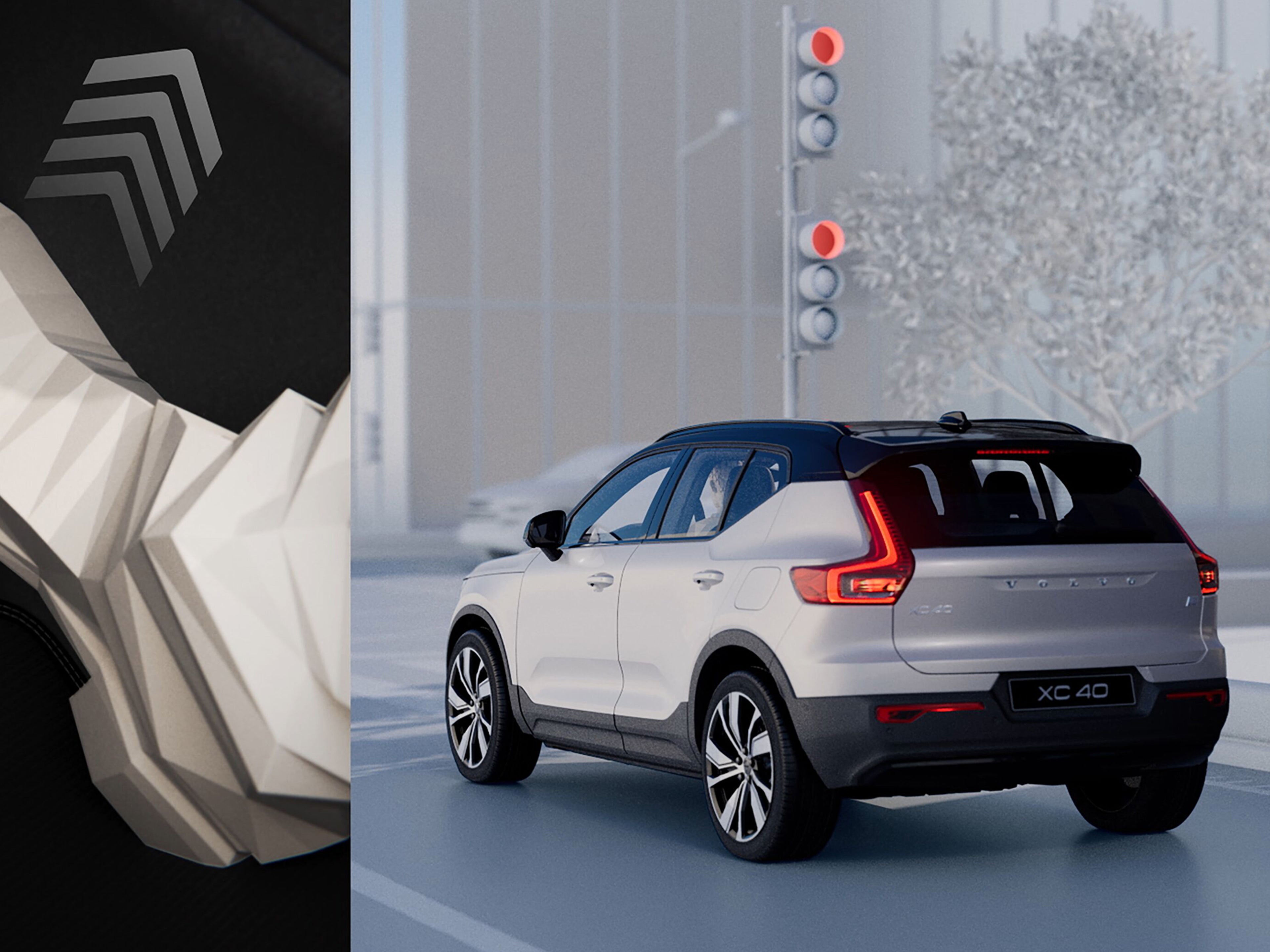 Volvo XC40 branco visto por trás, parado diante de um semáforo vermelho.