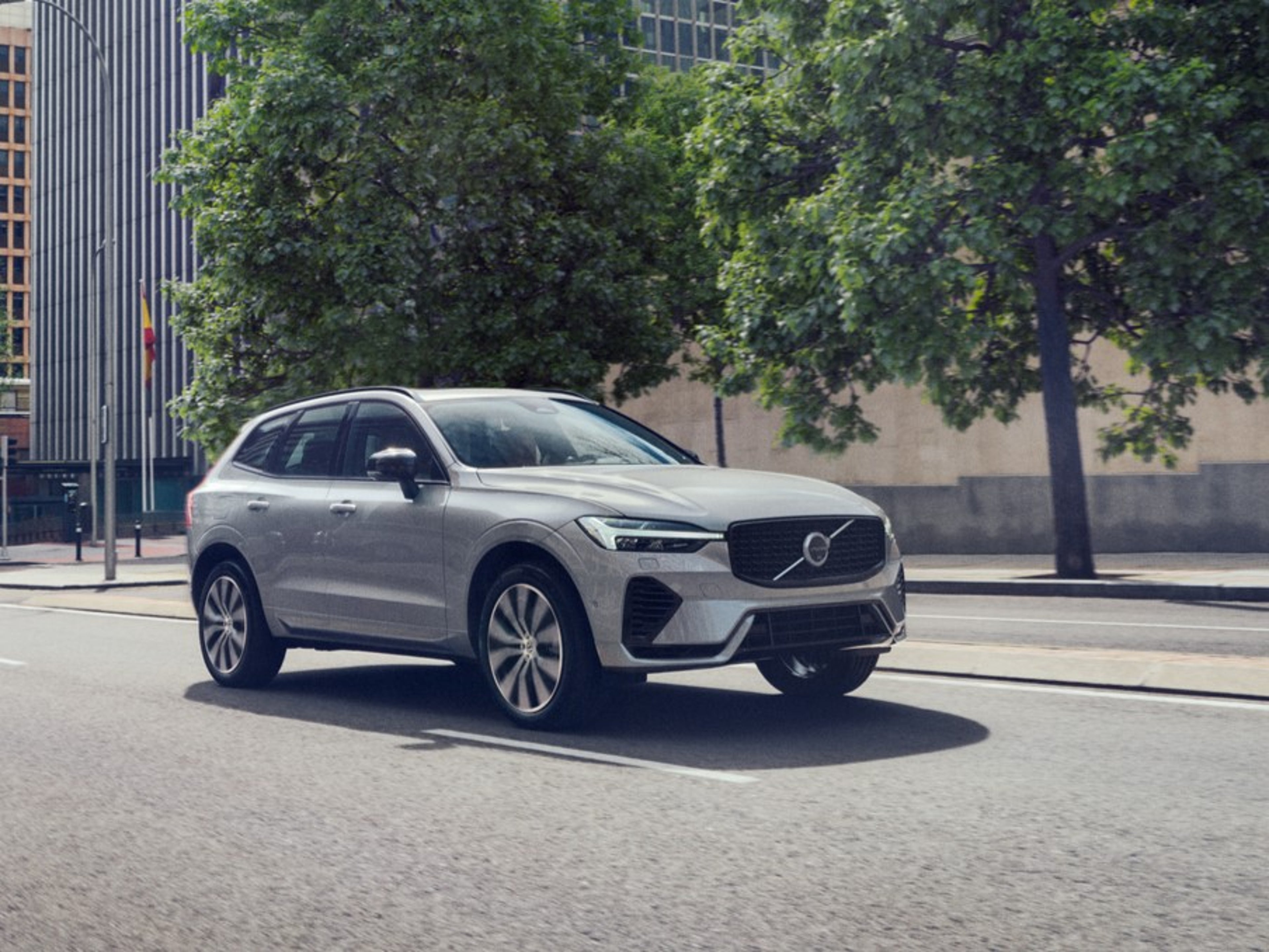 US Military Pricing Volvo - Volvo XC60 driving on a tree-lined city street