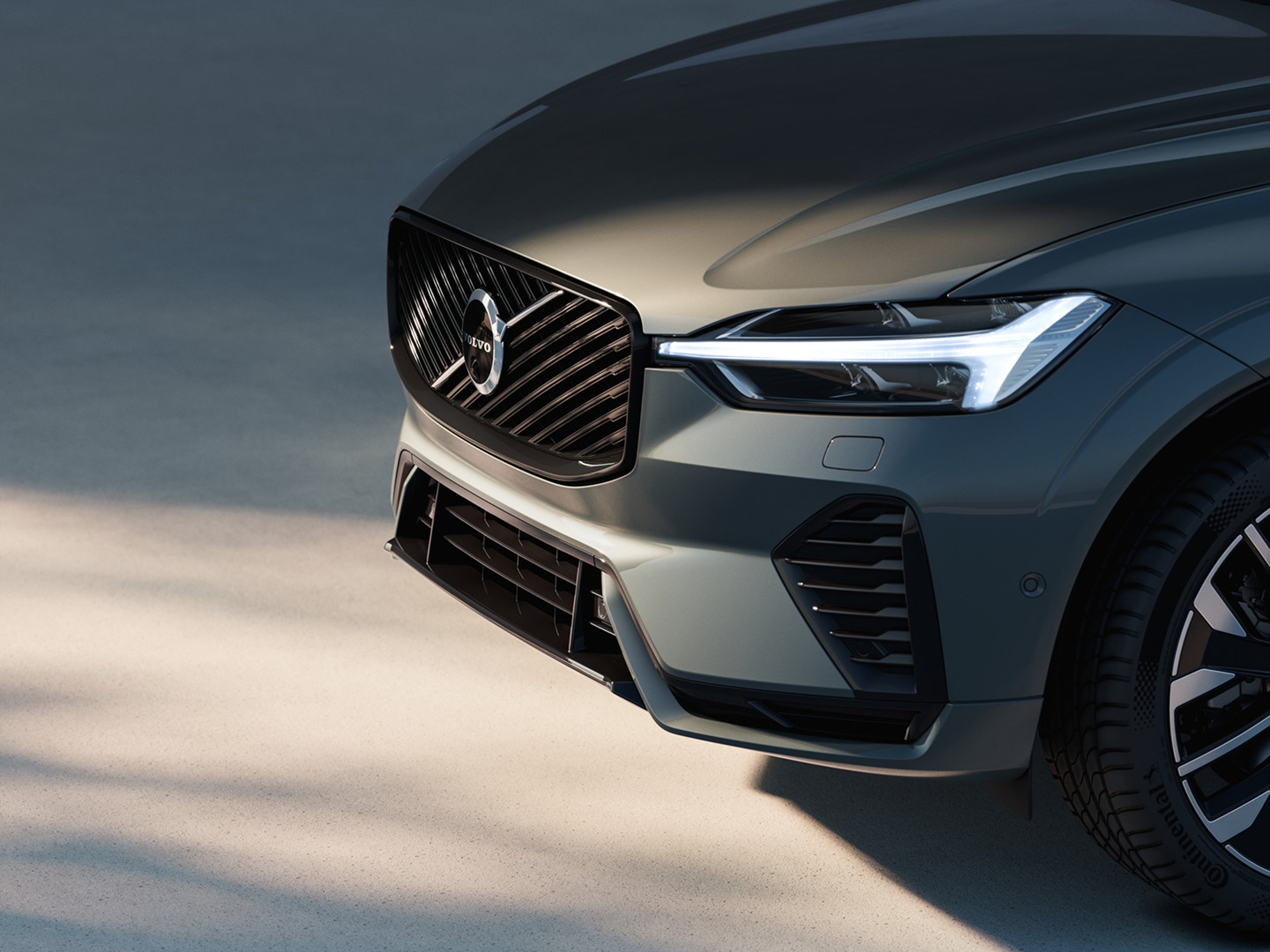 Front grille of XC60 plug in hybrid in soft sunlight