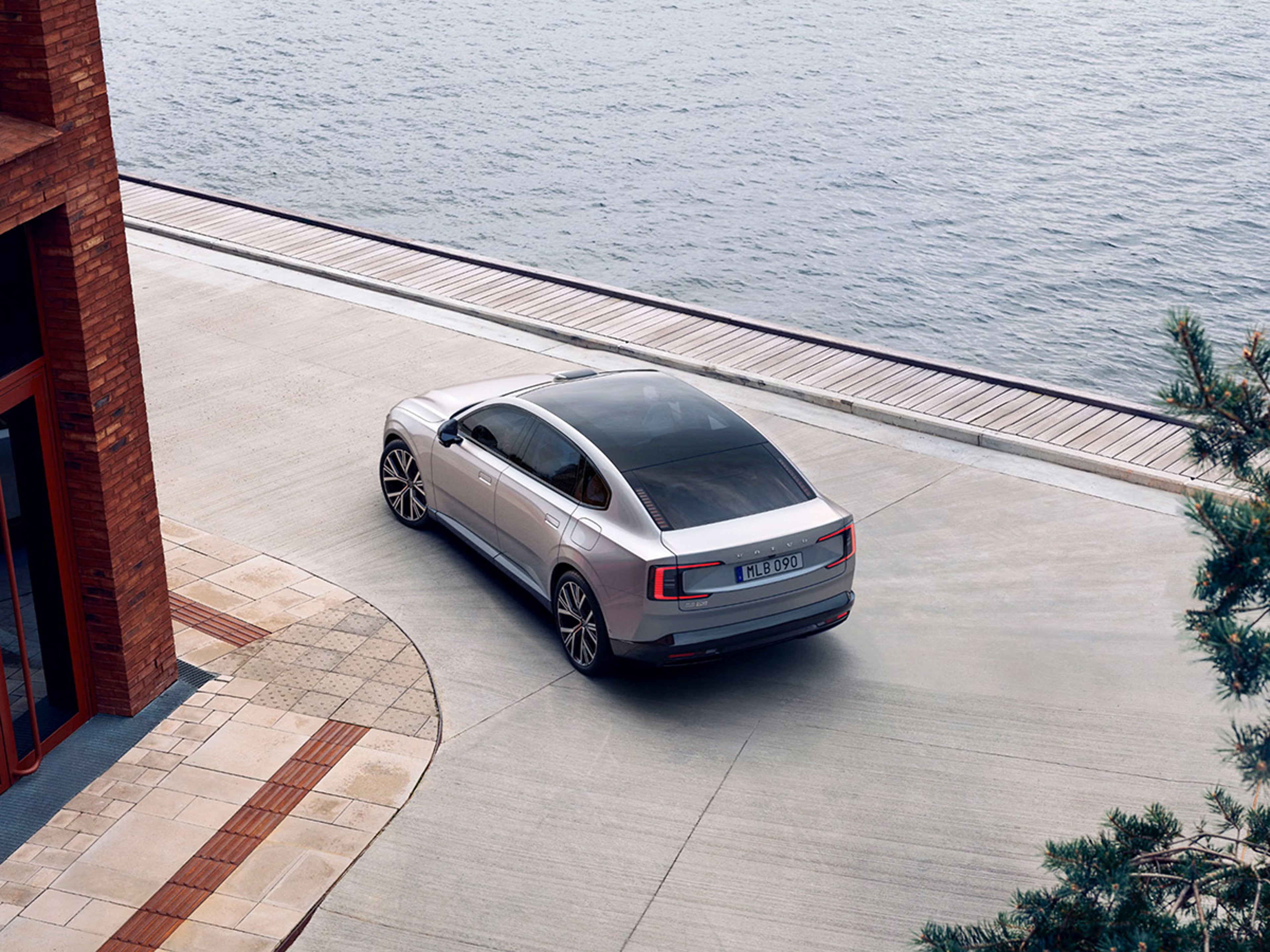 ES90 parked beside a building next to a lake