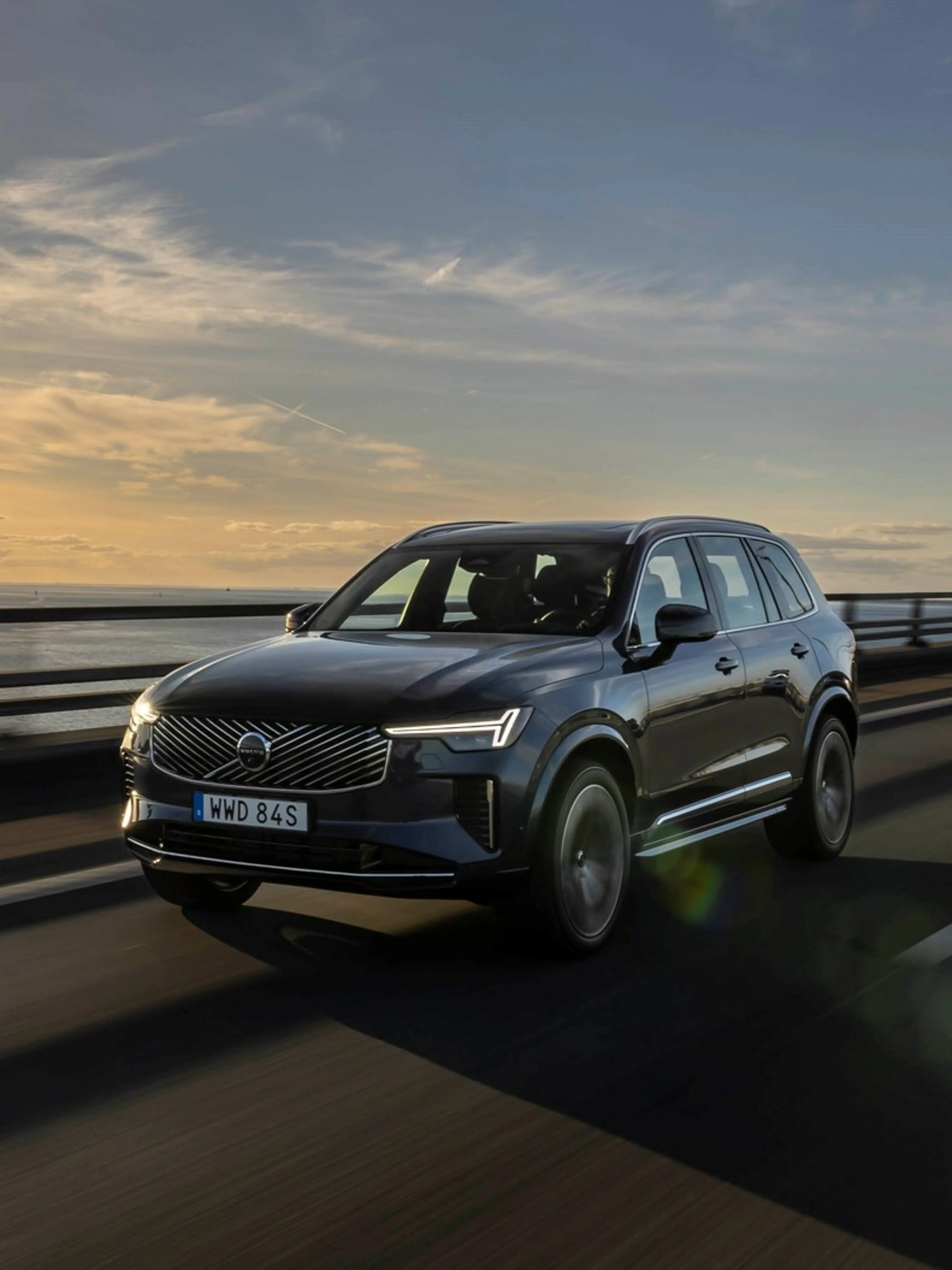 Volvo XC90 driving in sunny road