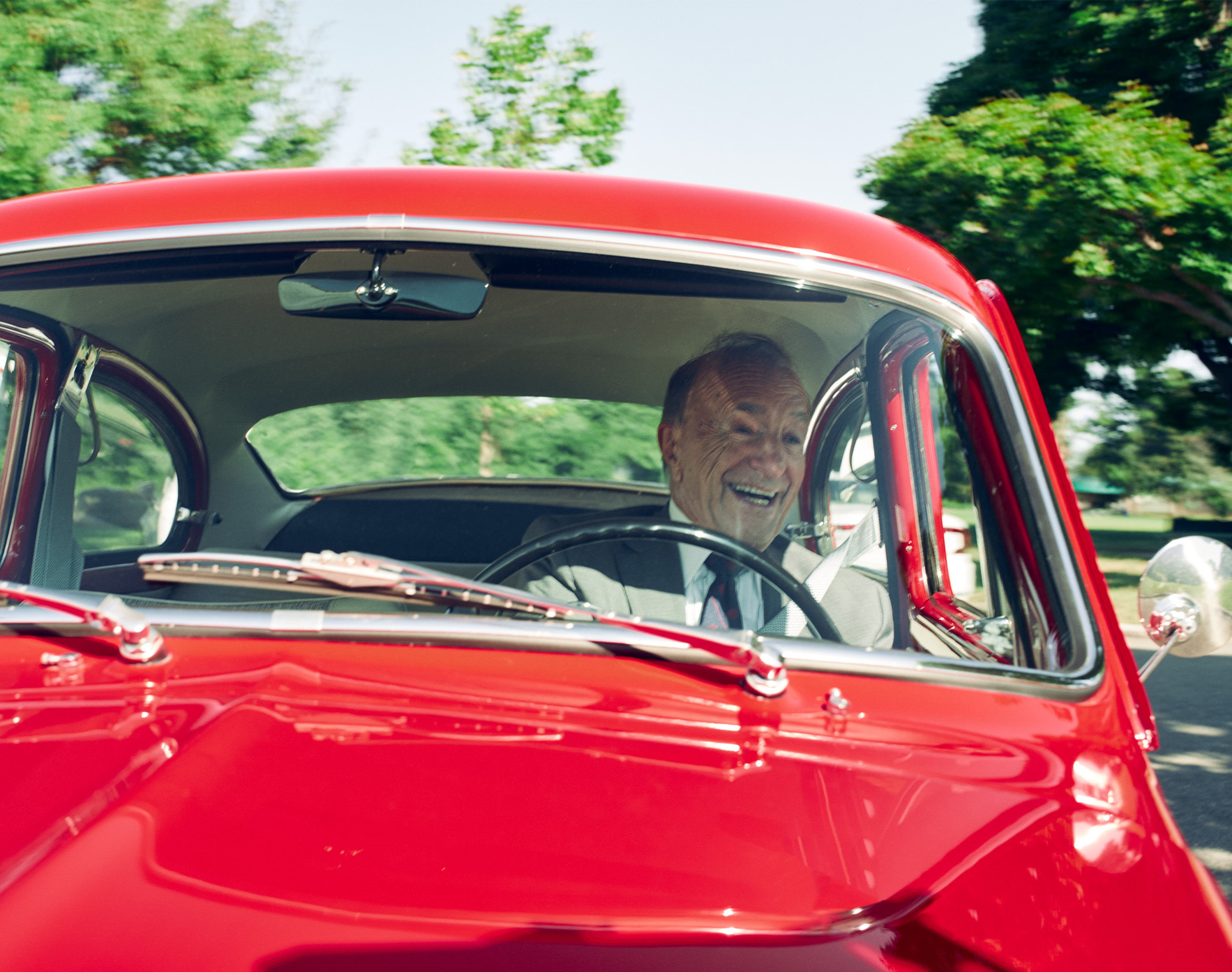 Man driving classic Volvo