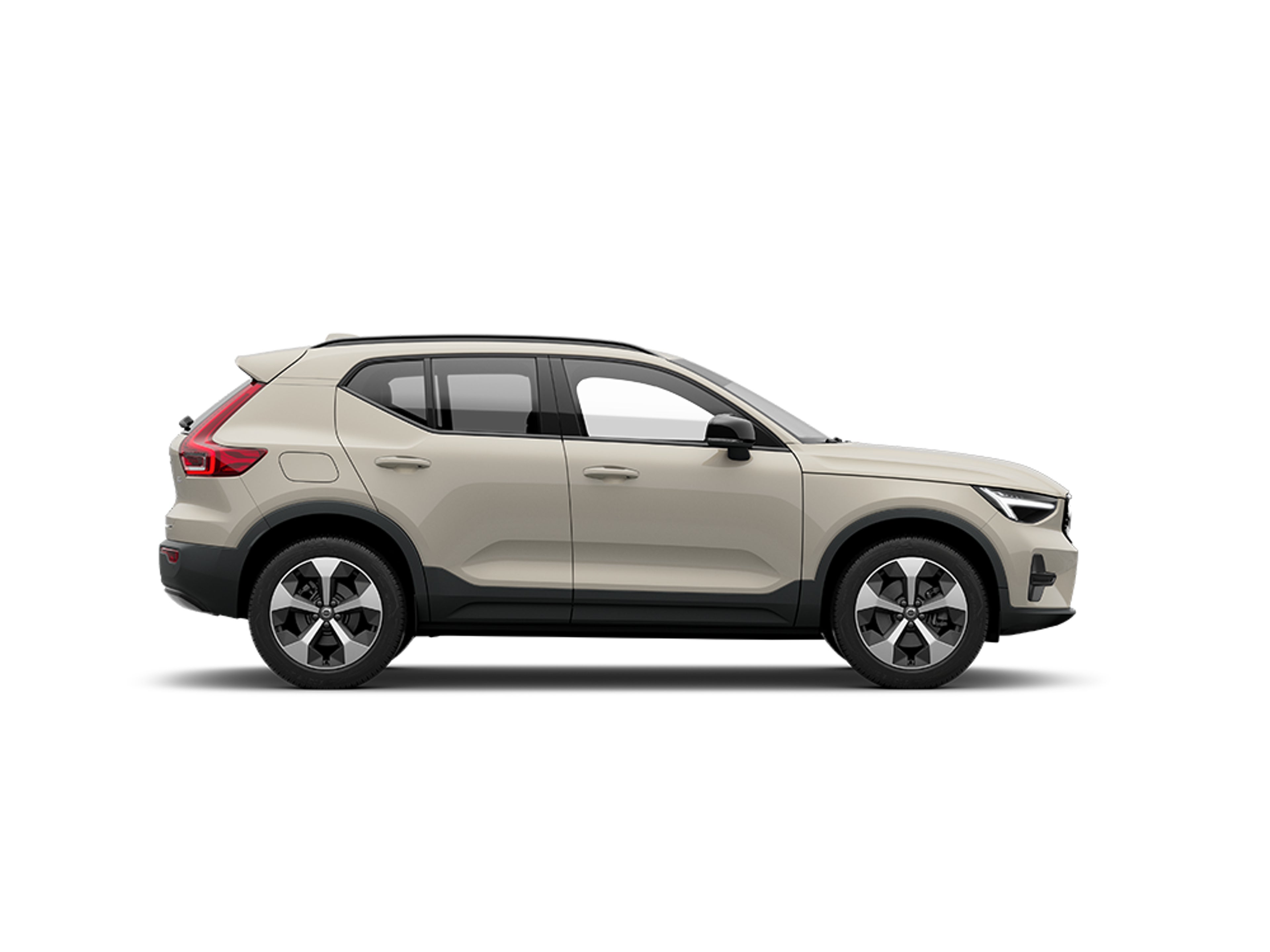Vue latérale d'un SUV Volvo XC40 beige sur fond blanc.