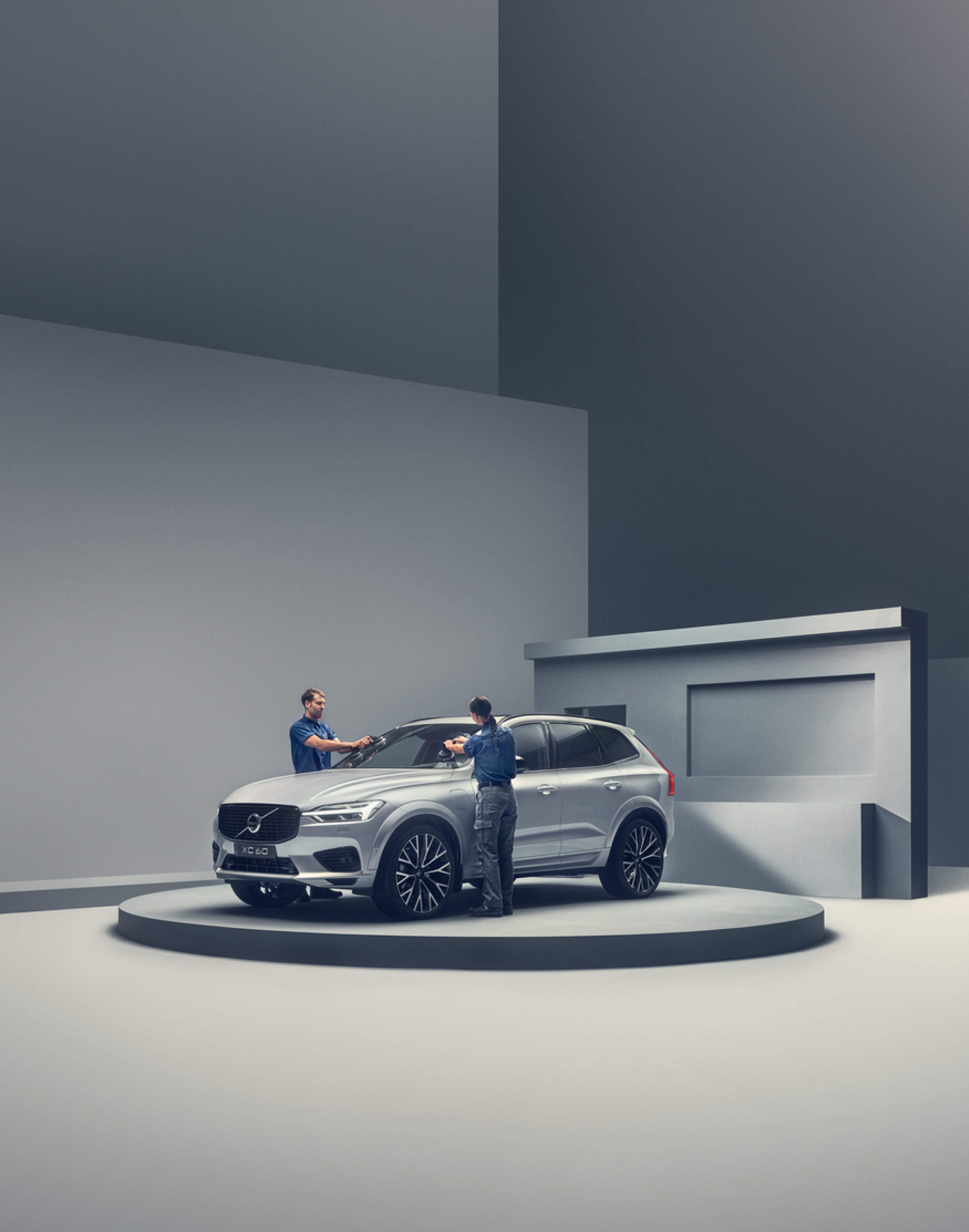 Car sitting on podium being cleaned