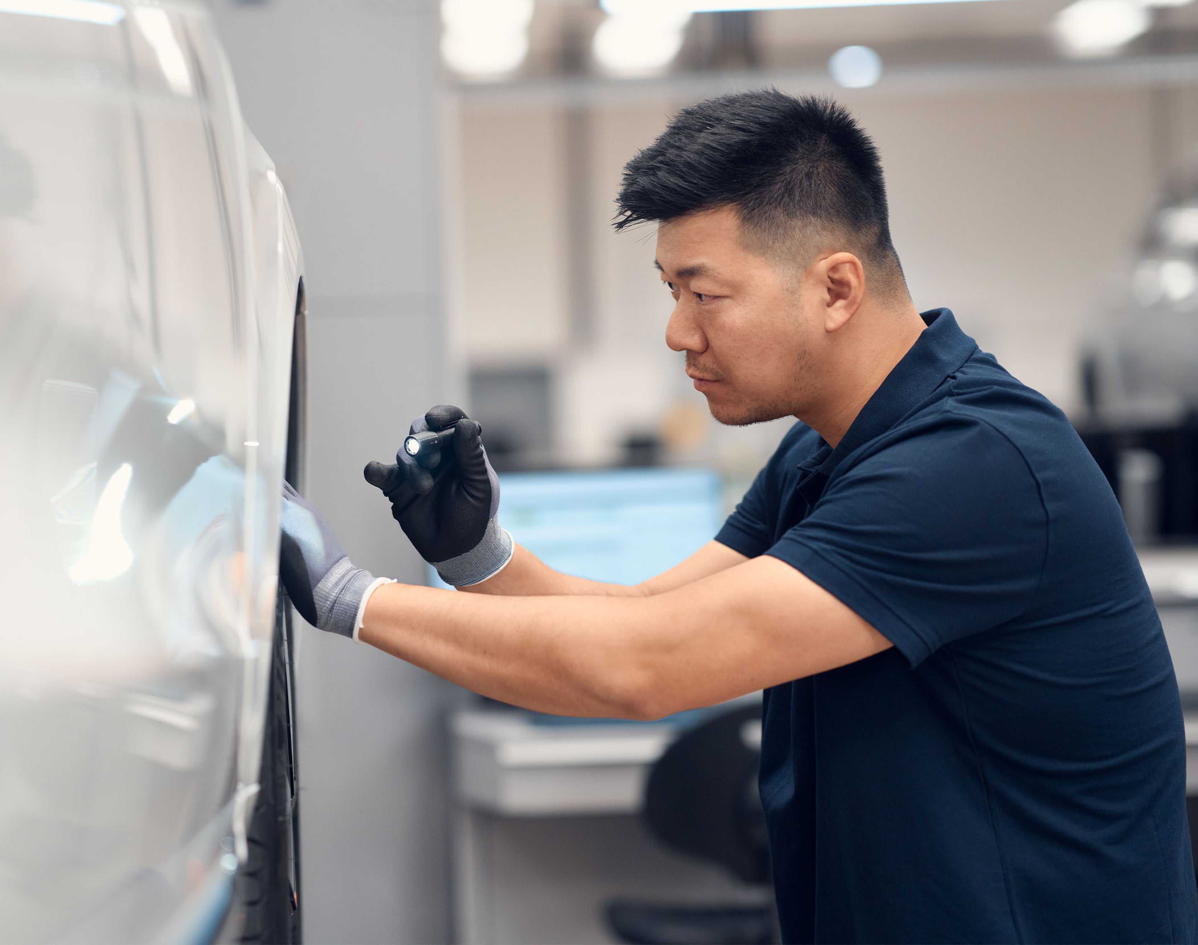 Certified-Collision technician fixing Volvo
