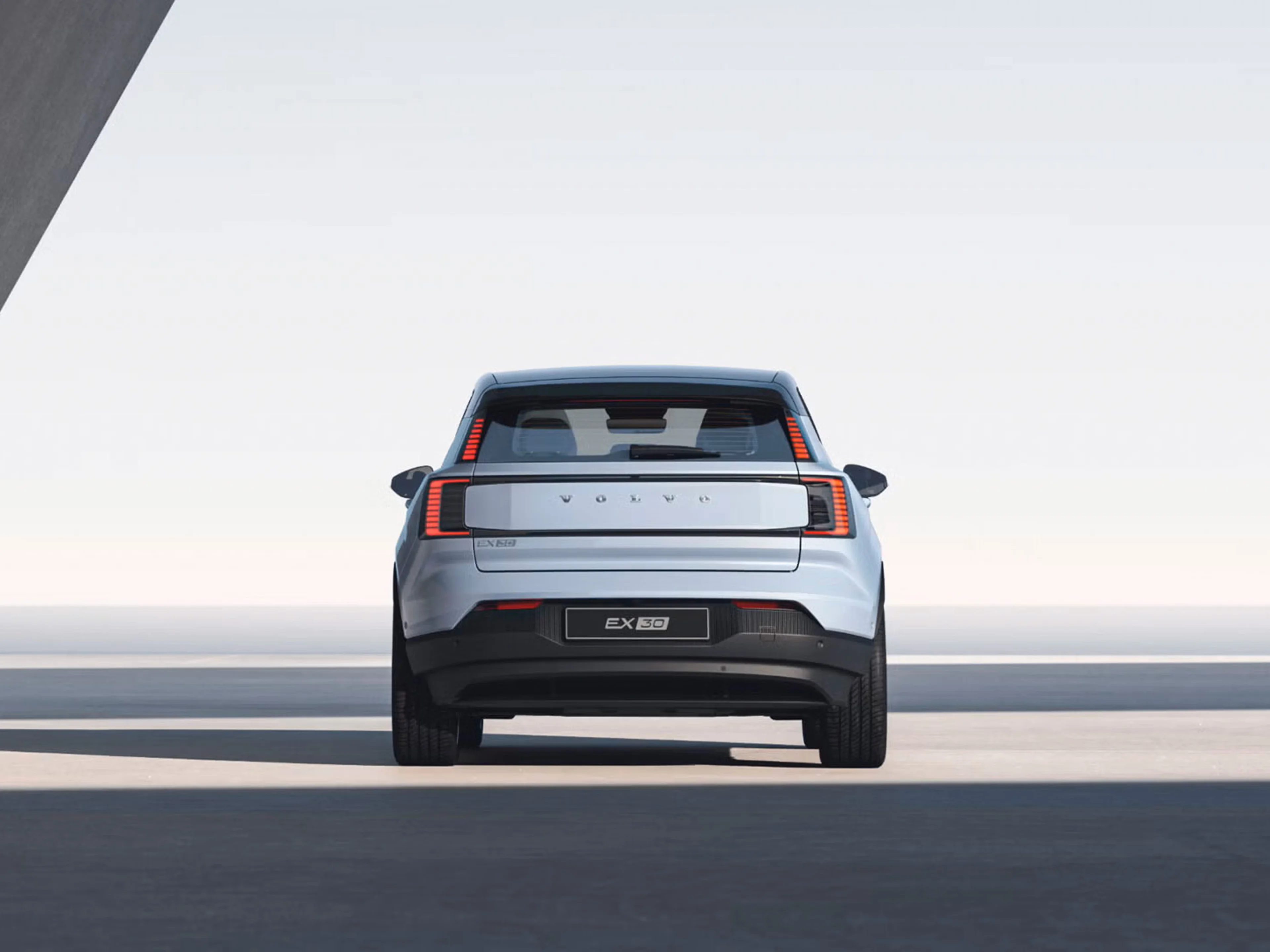 Rear view of EX30 against bright daylight background