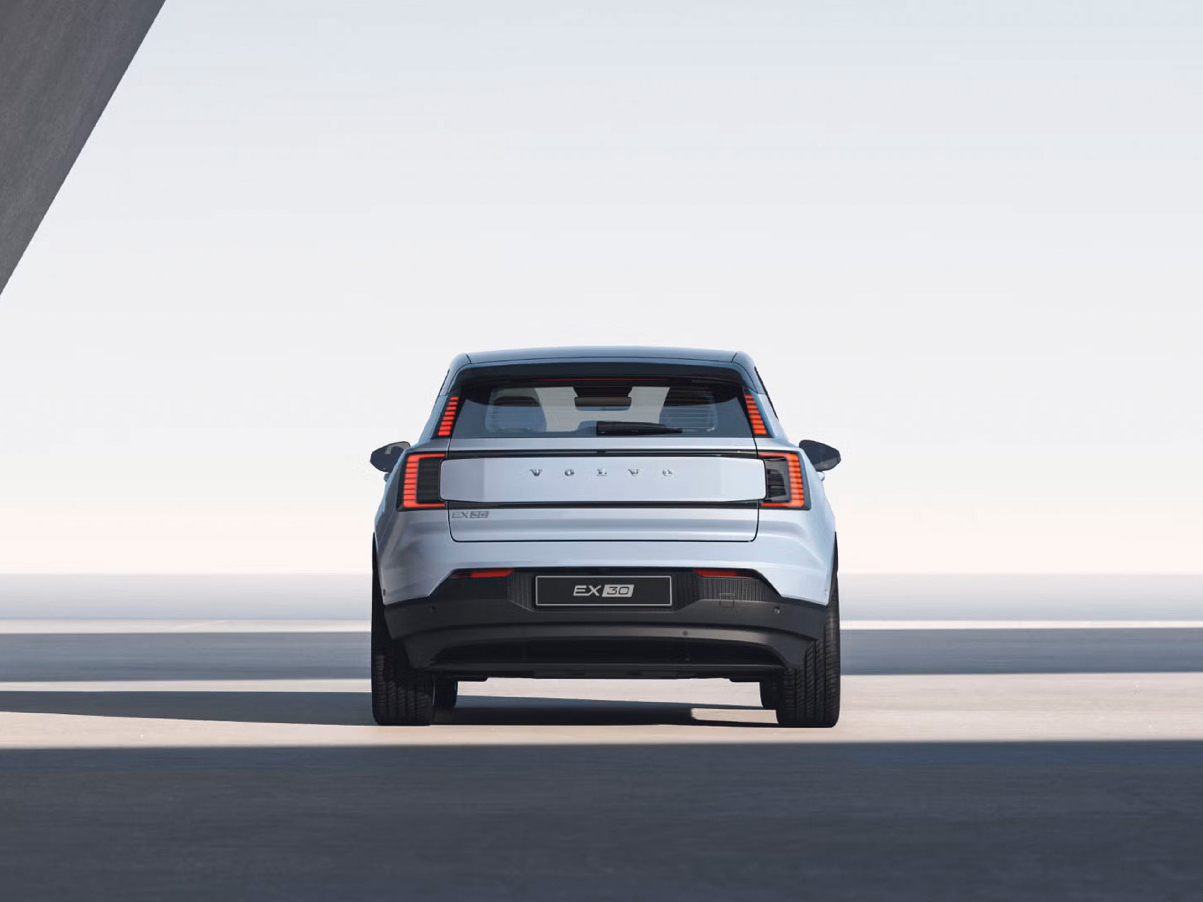 Rear view of EX30 against bright daylight background