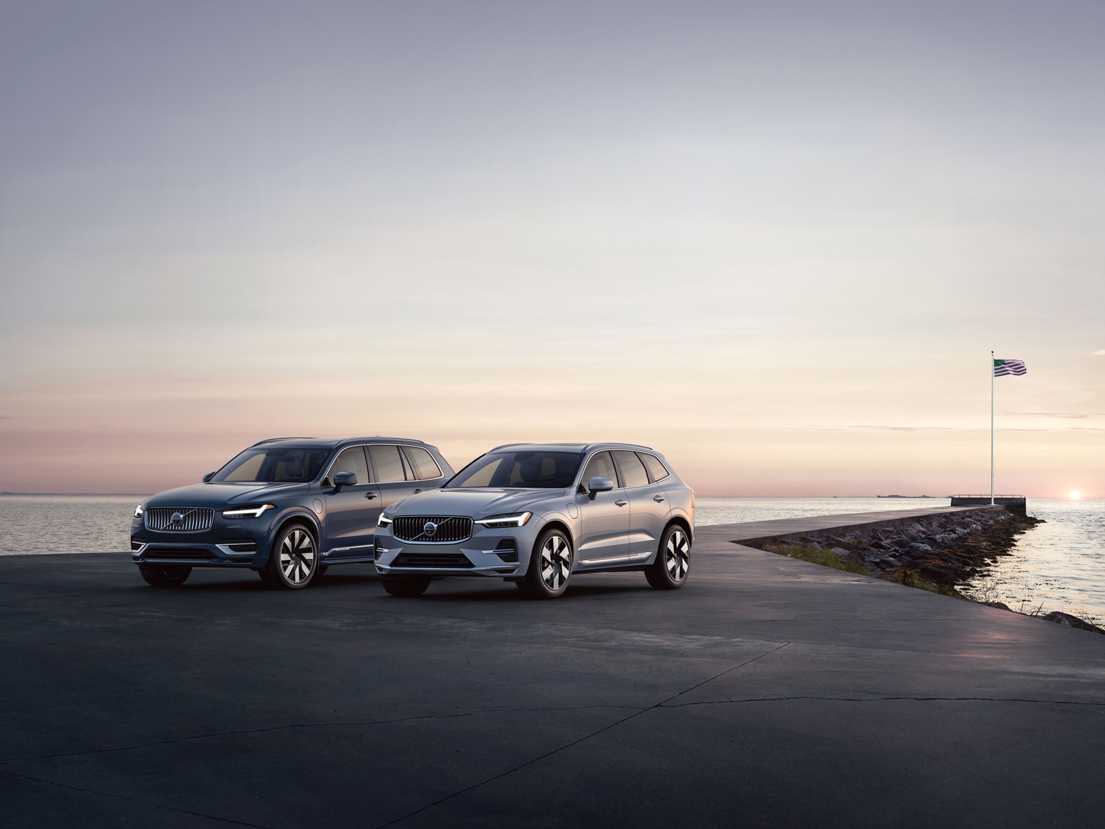 Volvo Overseas Delivery for Military - 2 Volvos parked by water