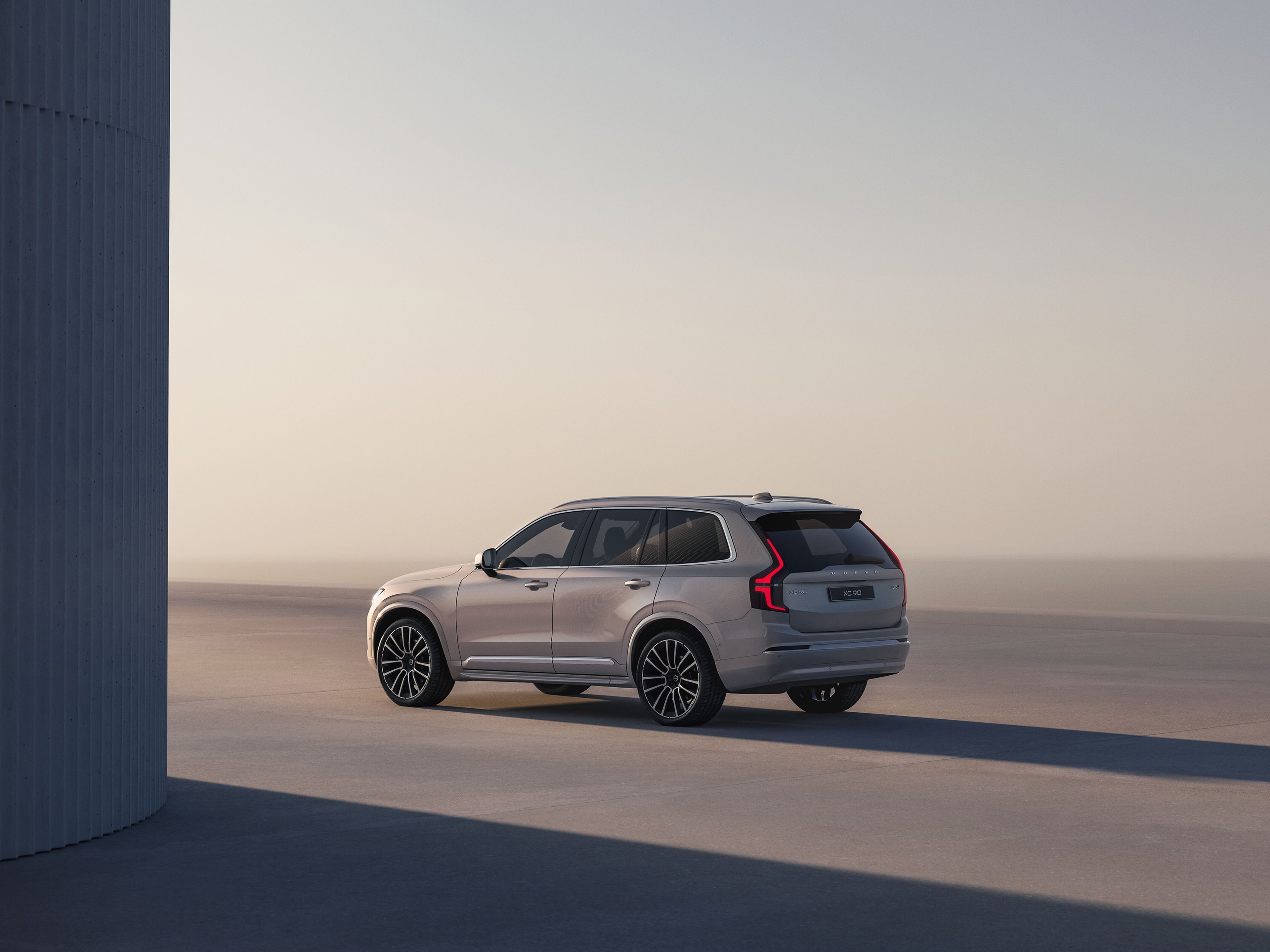 XC90 driving off into the sun