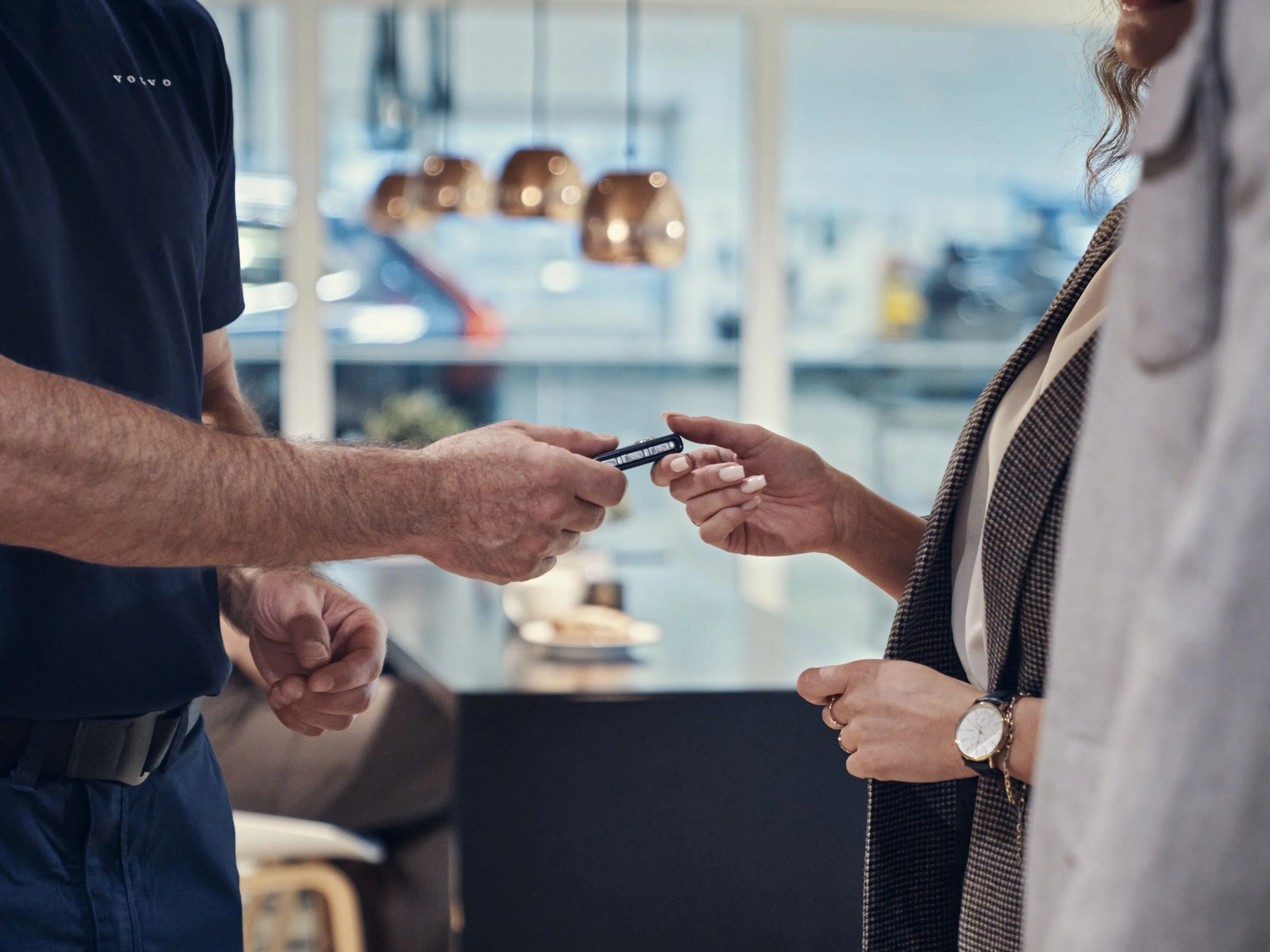 Volvo Valet: Pickup & Delivery Program - person handing key to another person