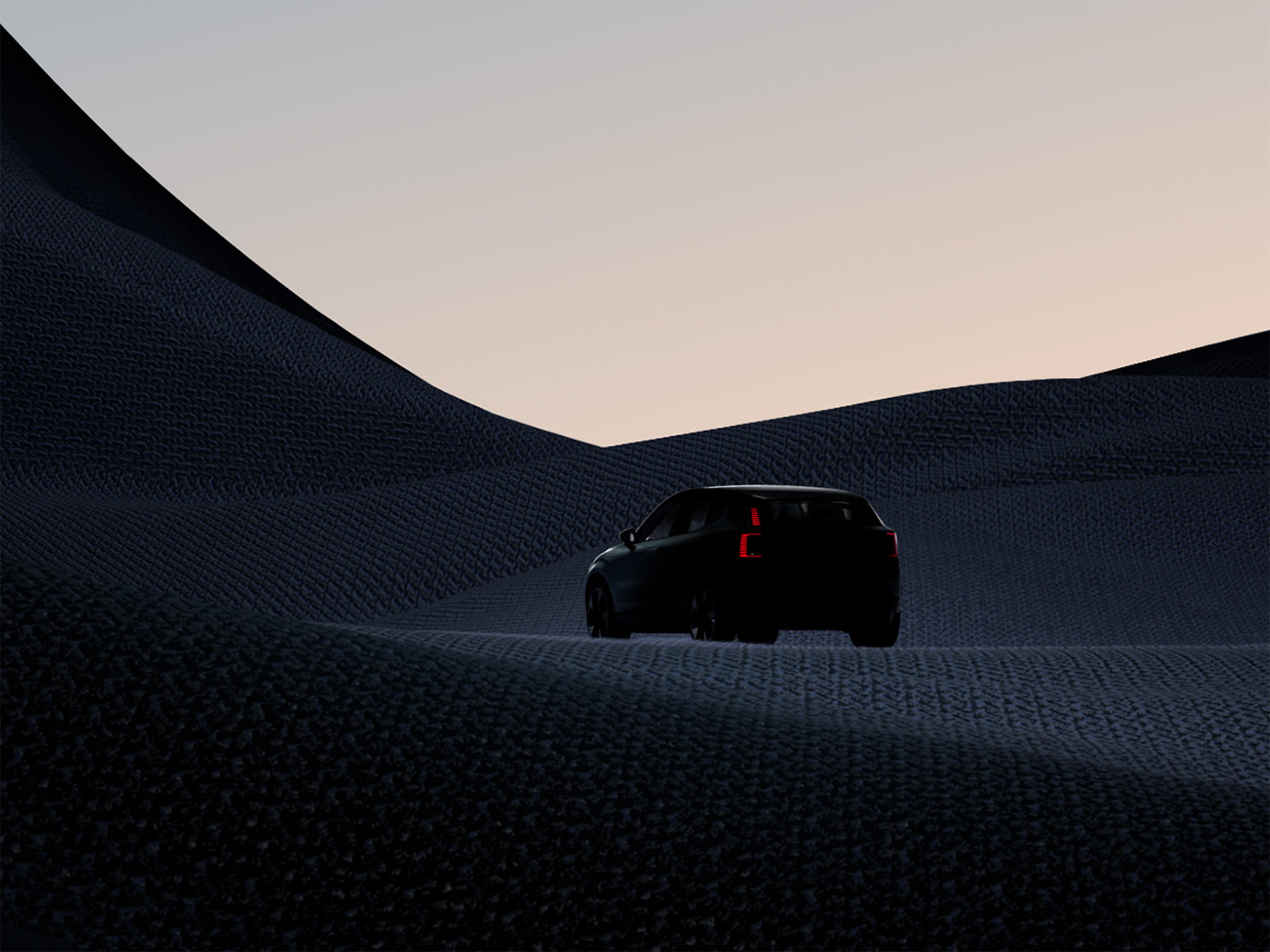 Temen Volvo EX30 na temni pokrajini.