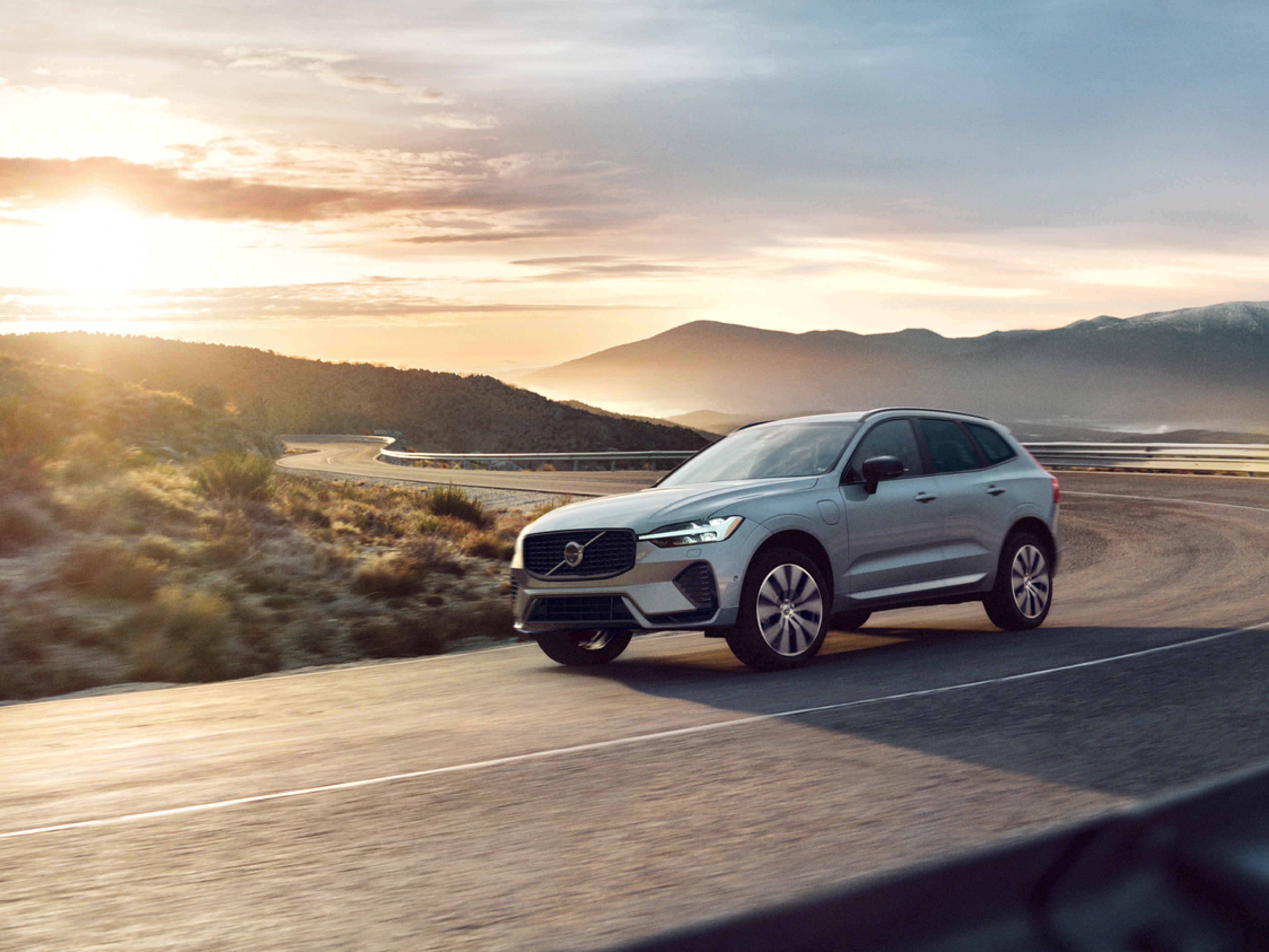 Volvo Military Overseas Delivery - Car driving on road past mountains