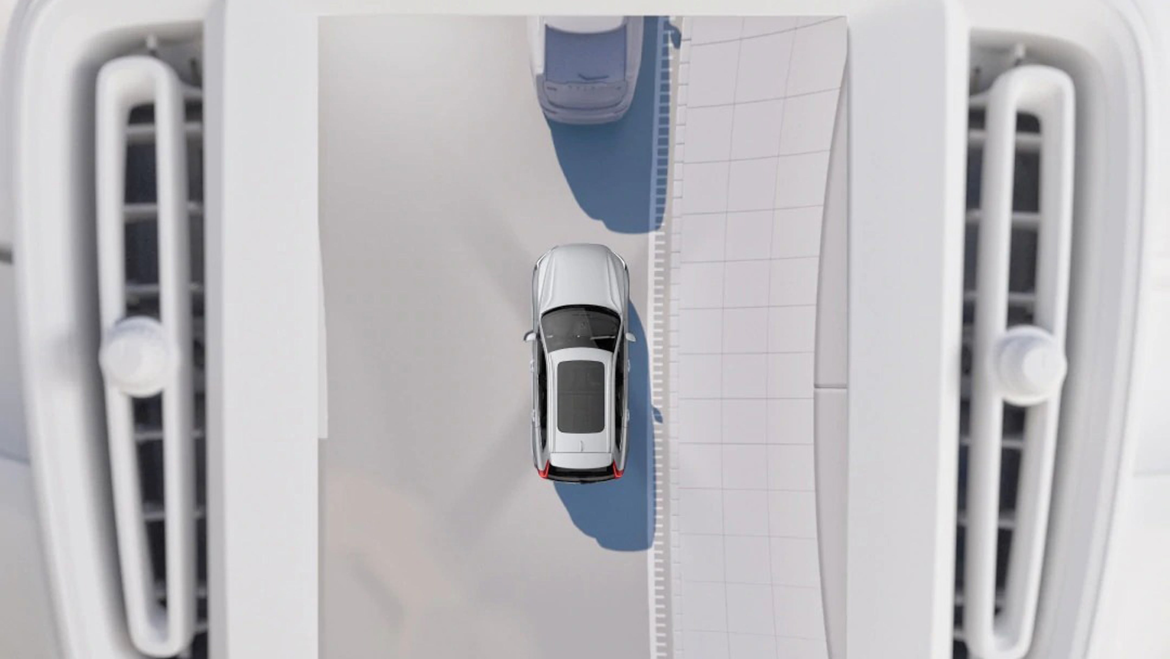 Vue du dessus d'une Volvo se garant entre deux autres, avec capteurs et lignes de guidage visibles à droite