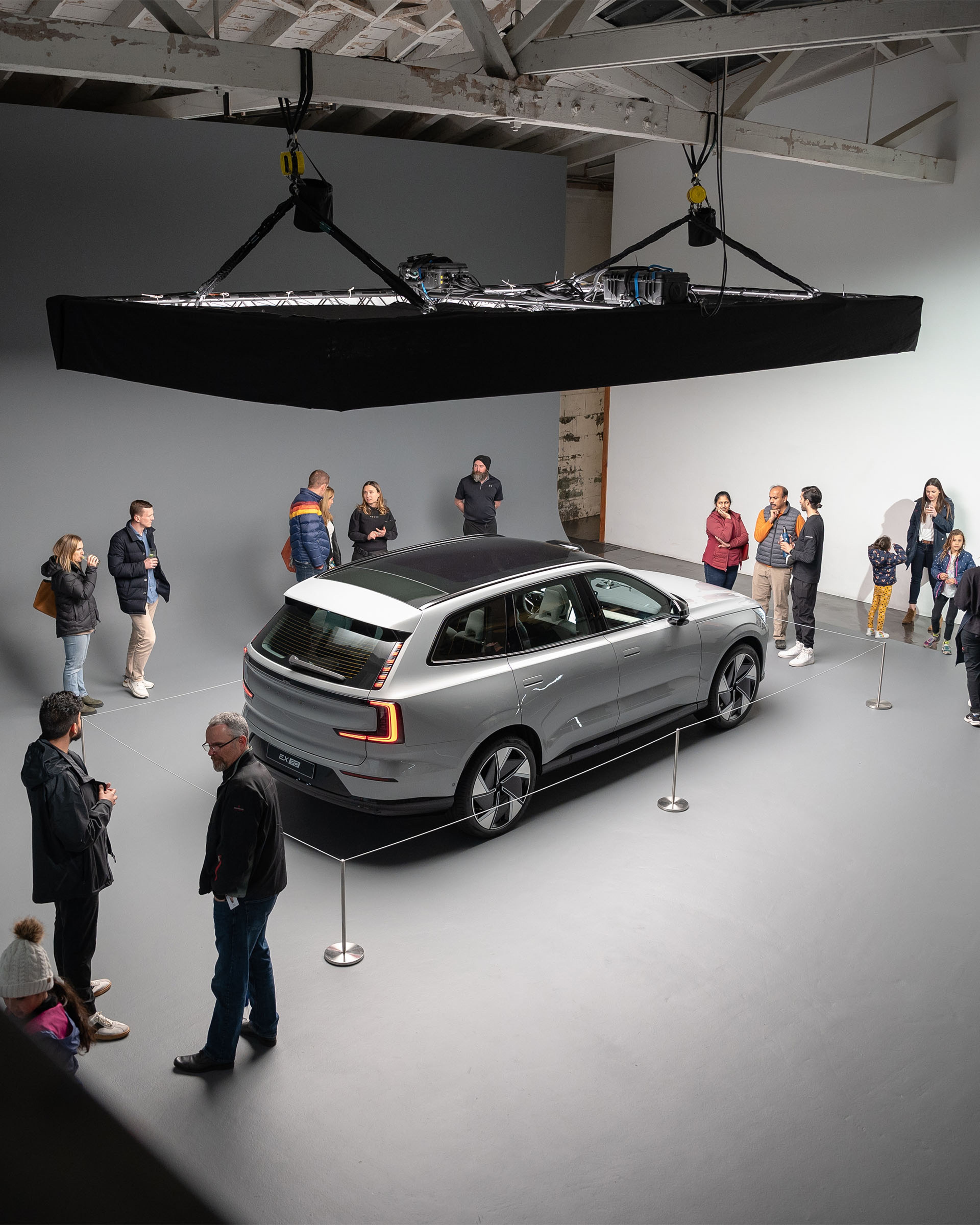 People tour Volvo car in studio