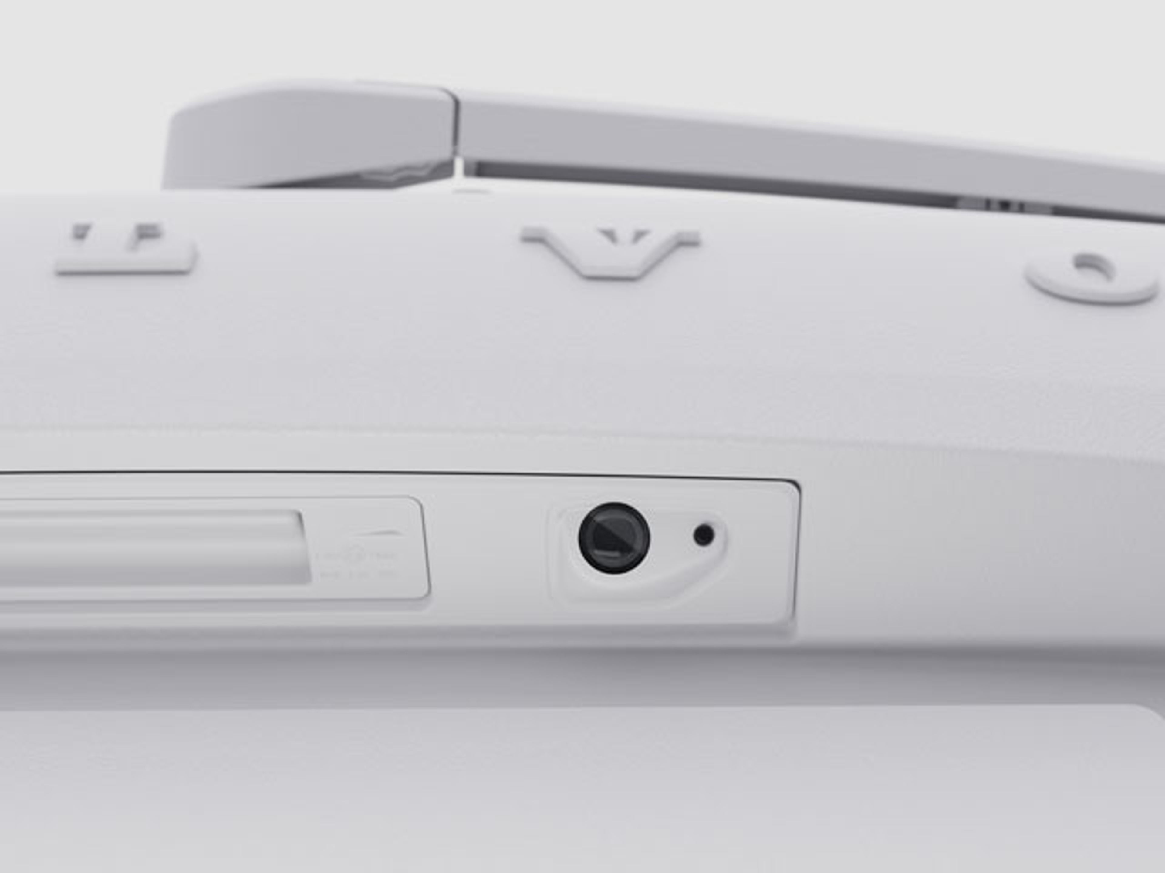 Spolarmunstycke för backkamera