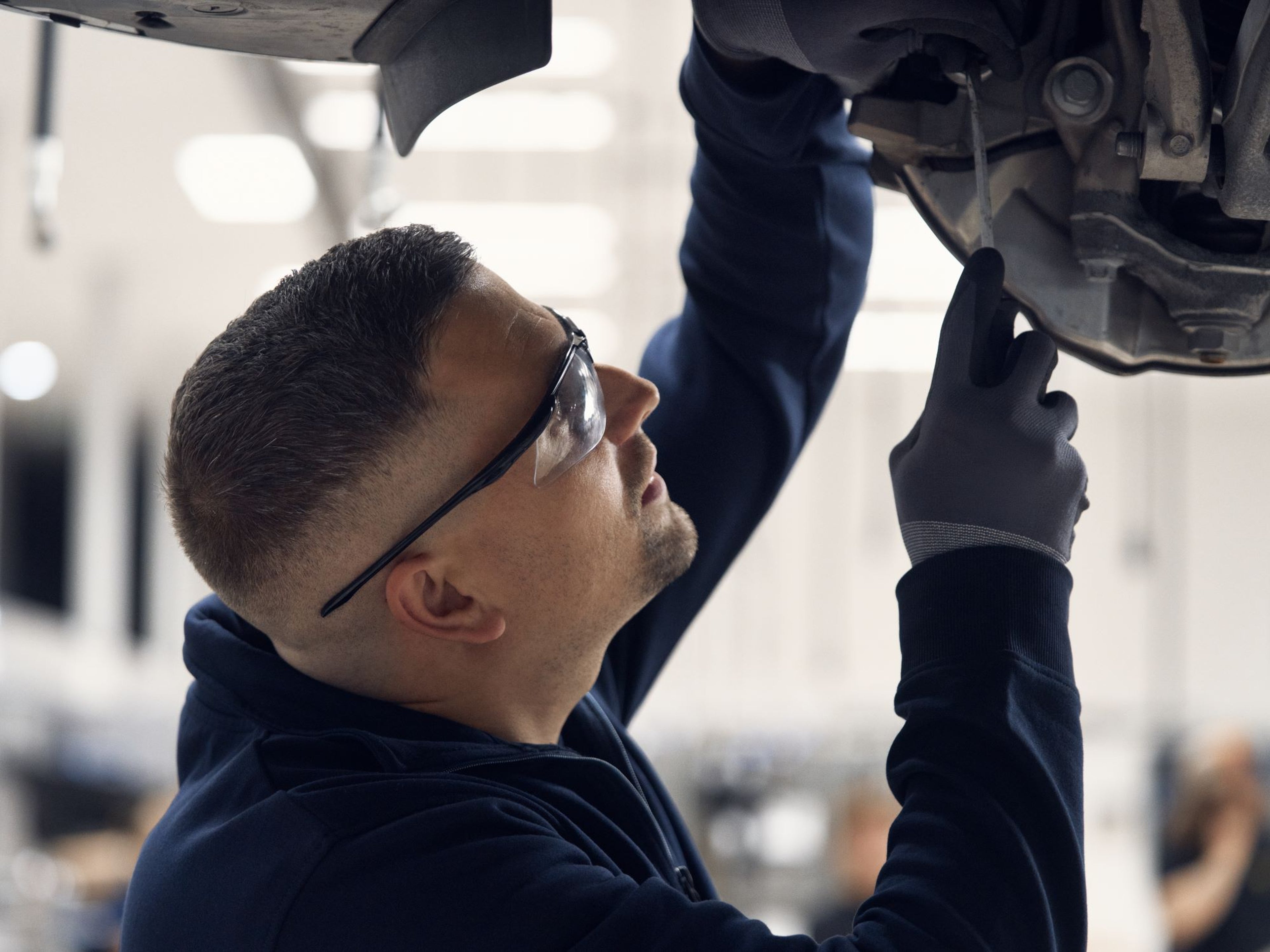 Volvo Complementary Factory Scheduled Maintenance - technician working on car