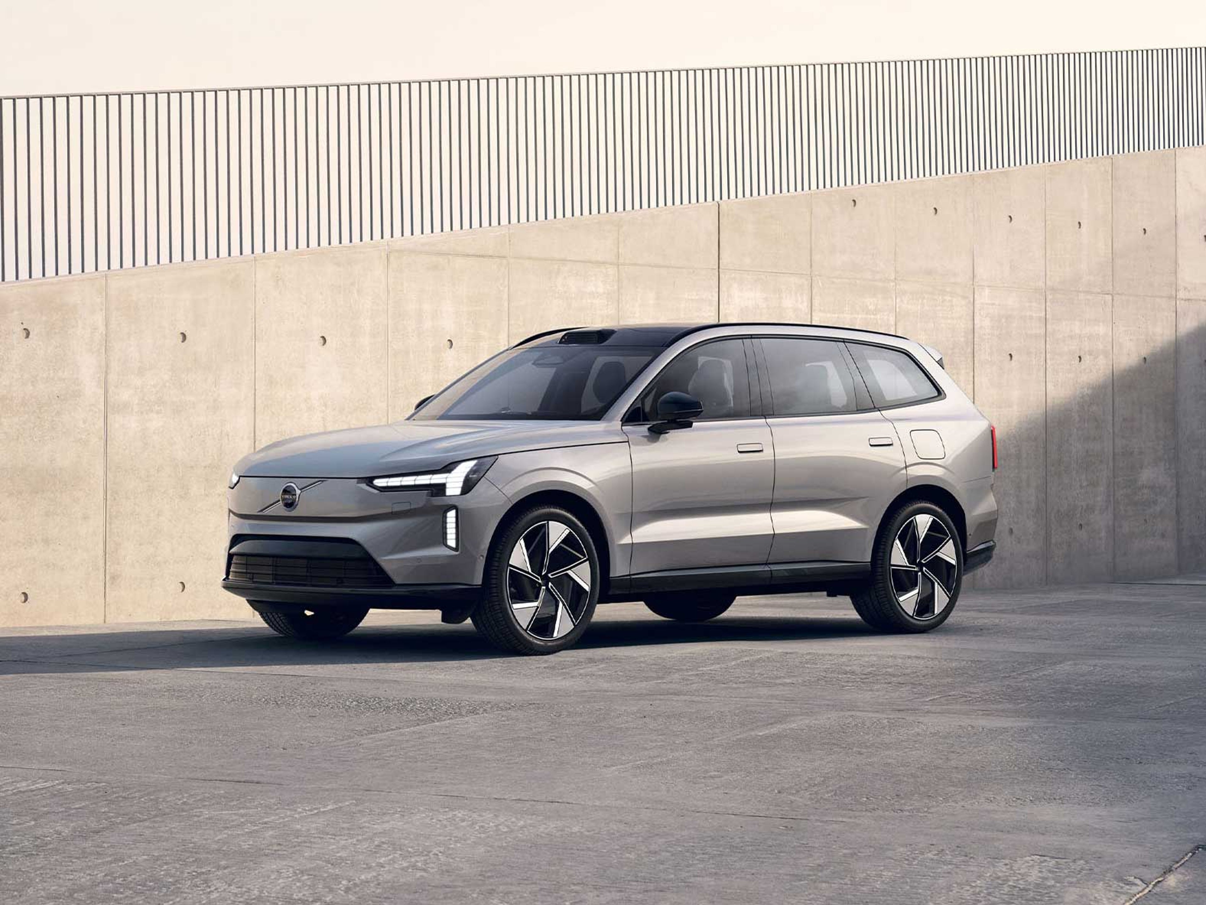 Volvo EX90 All Electric SUV parked by wall