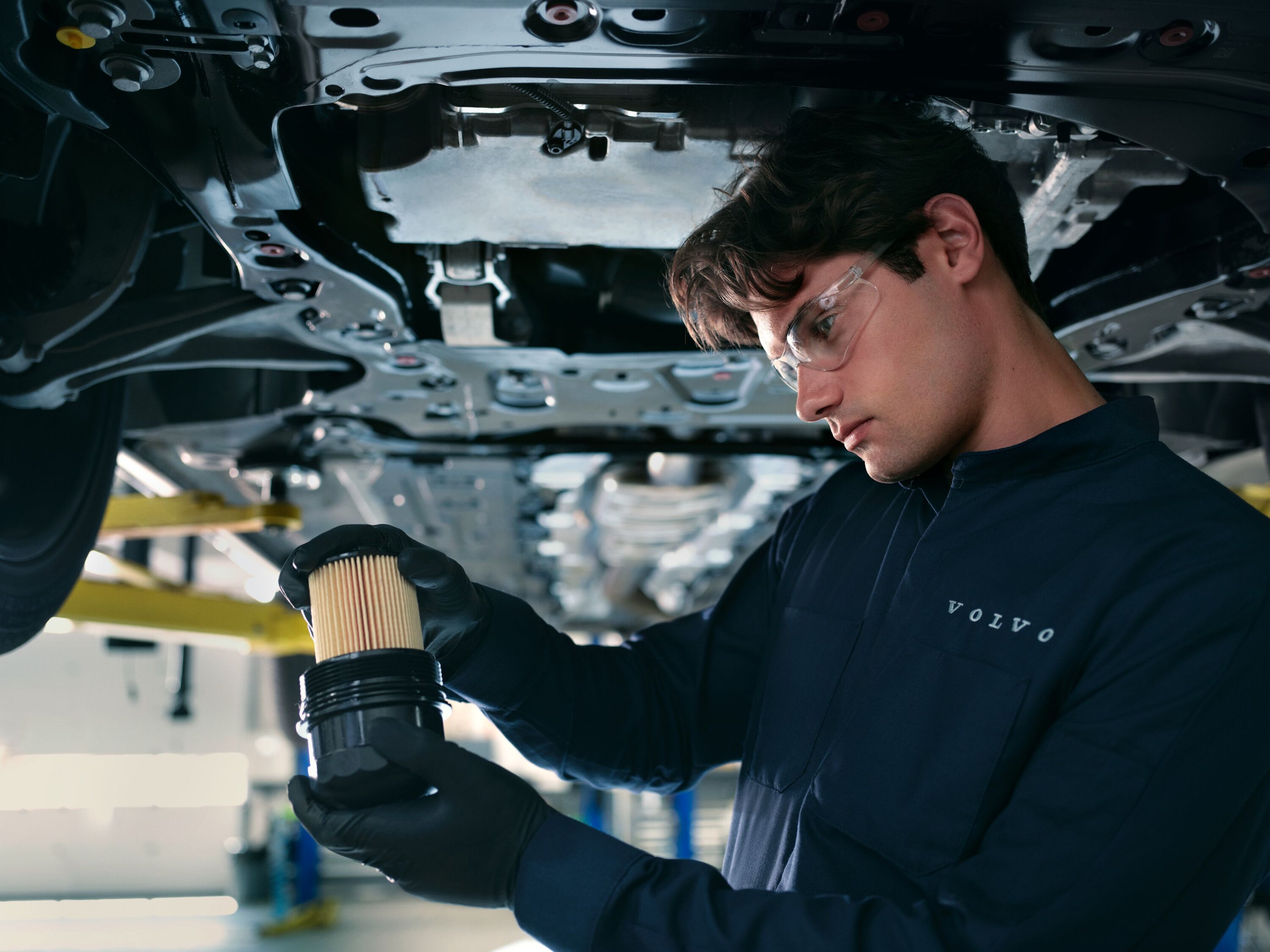 Volvo technician holding oil filter