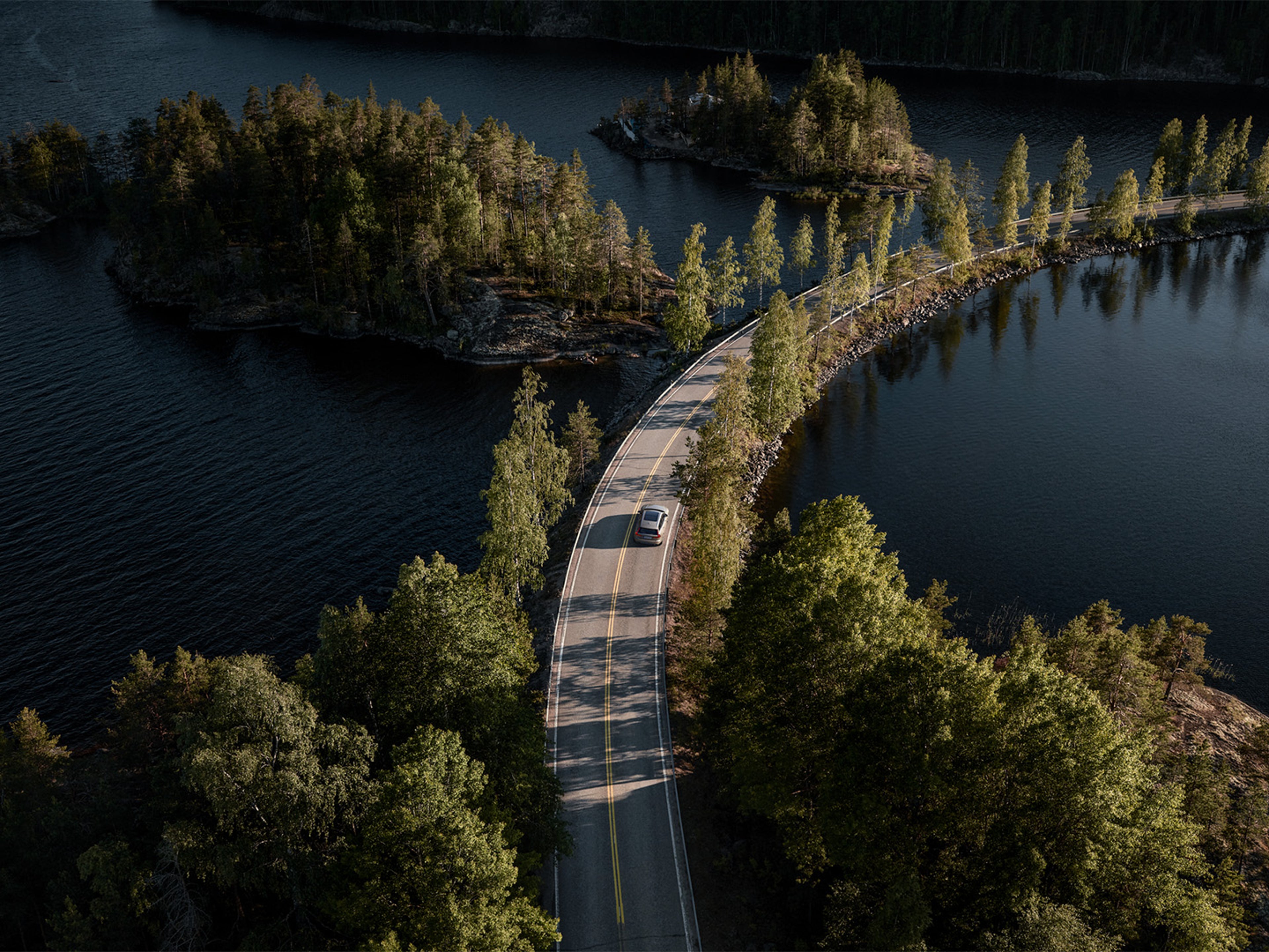Environmental Sustainability and Volvo - Car driving down a country road