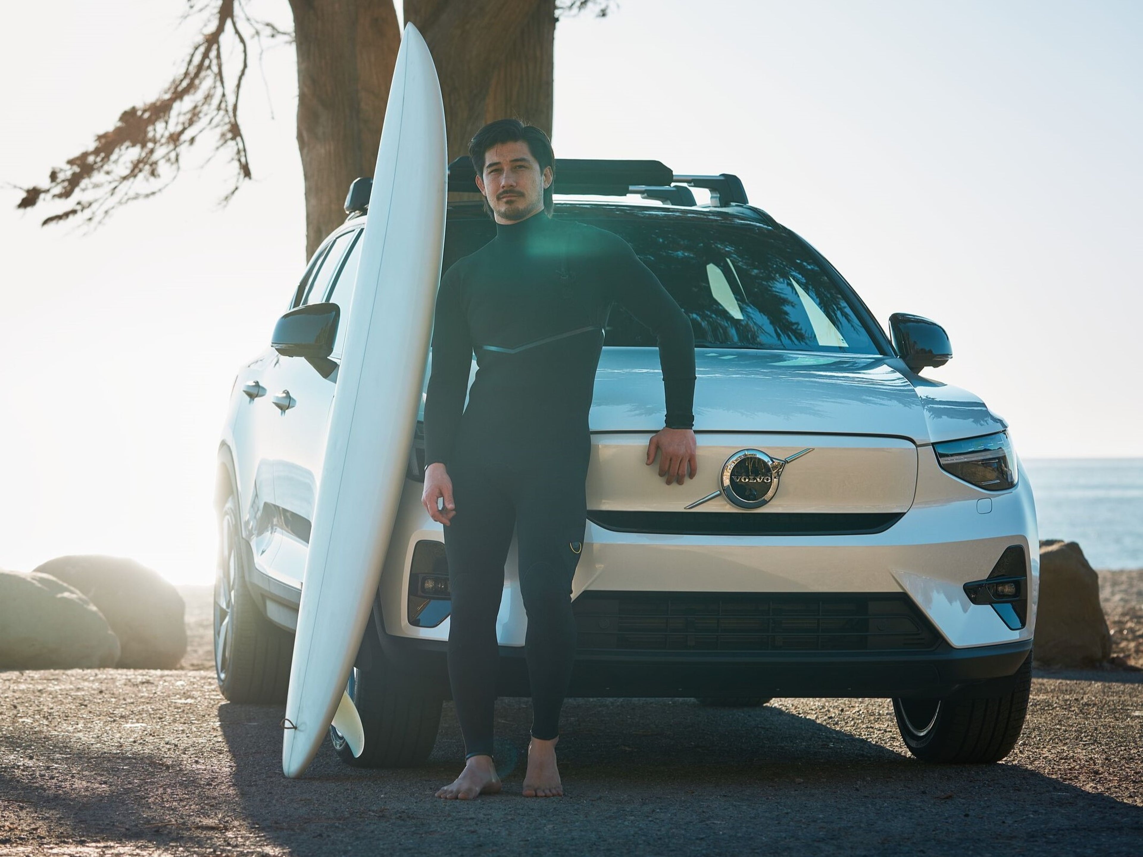 Man standing in front of Volvo electric SUV