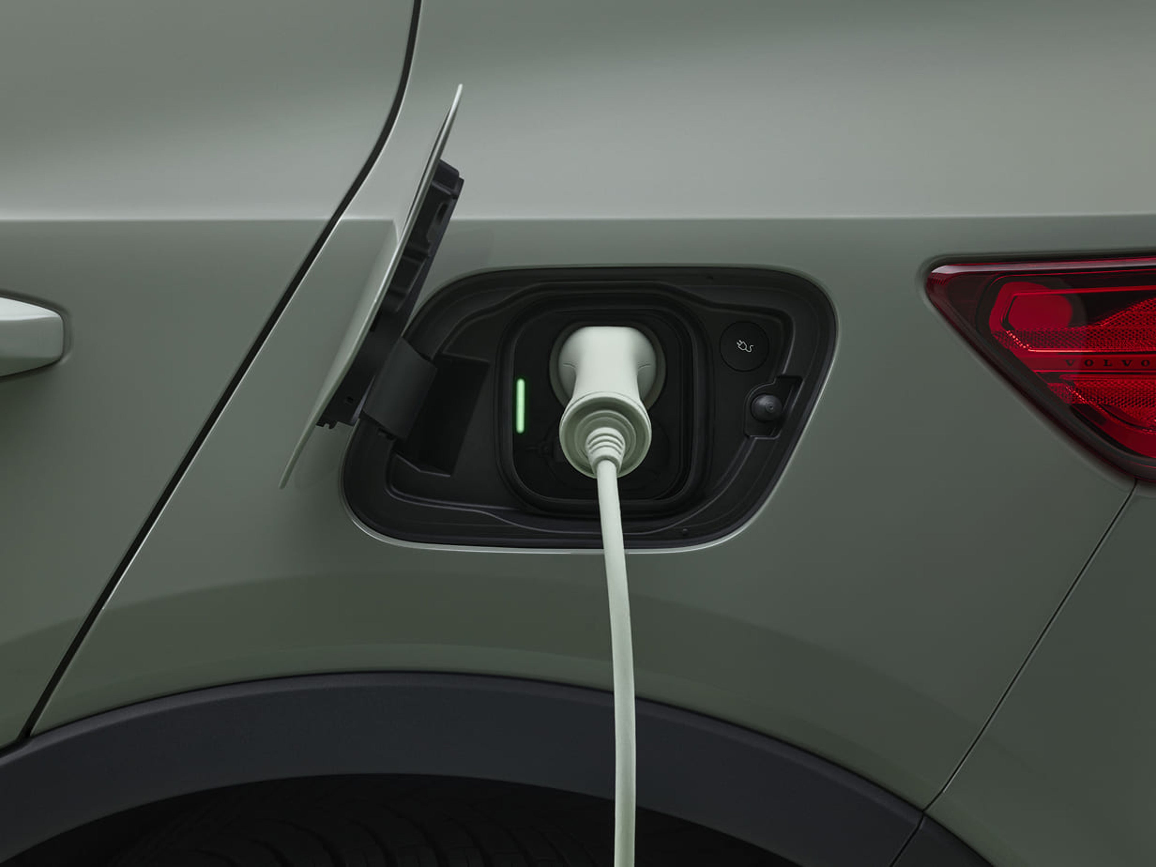 Electric cord plugged in to an electric car