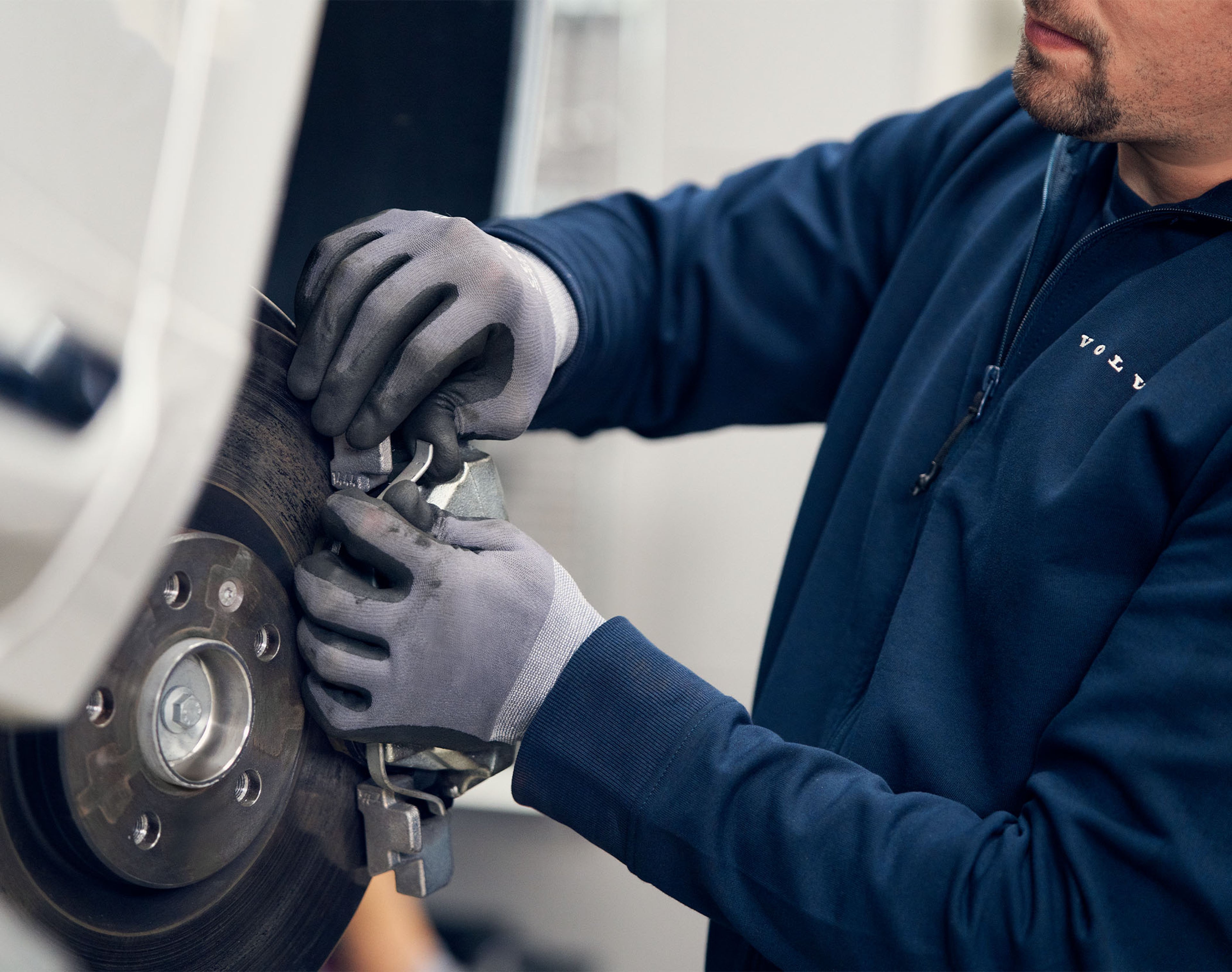 Volvo technician working on car