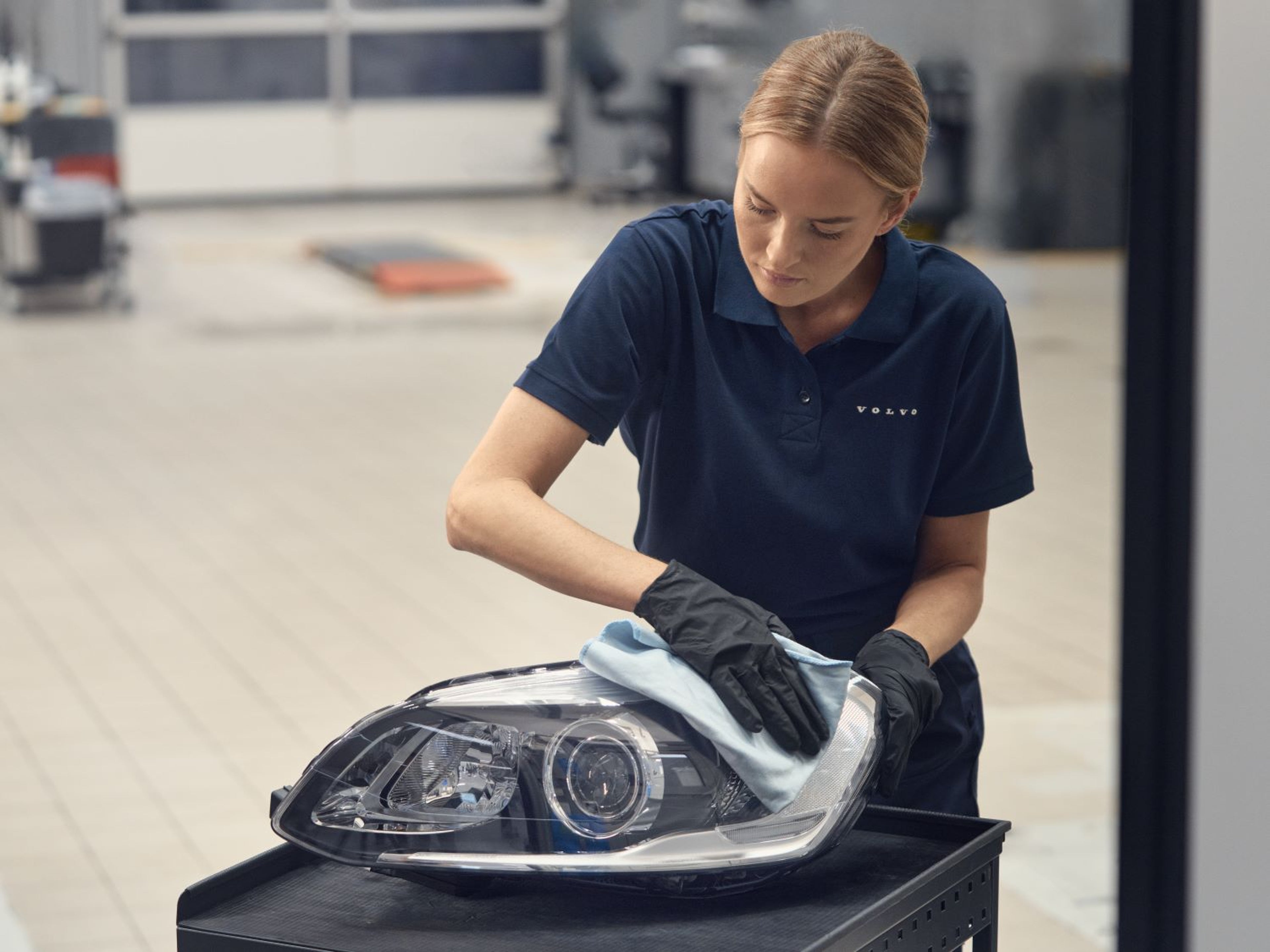 Genuine Parts - parts you can count on - image of technician with headlight