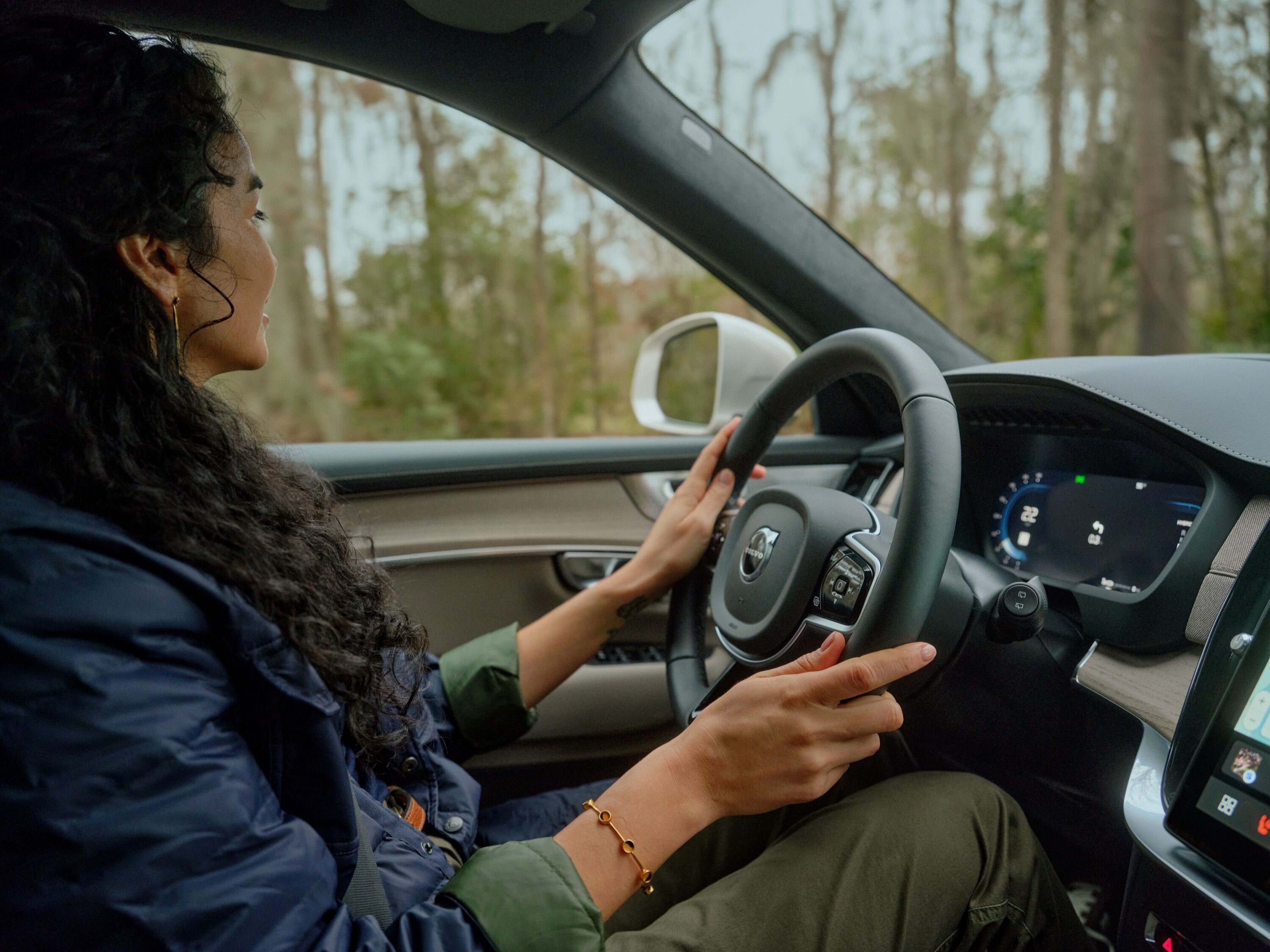 Woman driving Volvo XC90 SUV