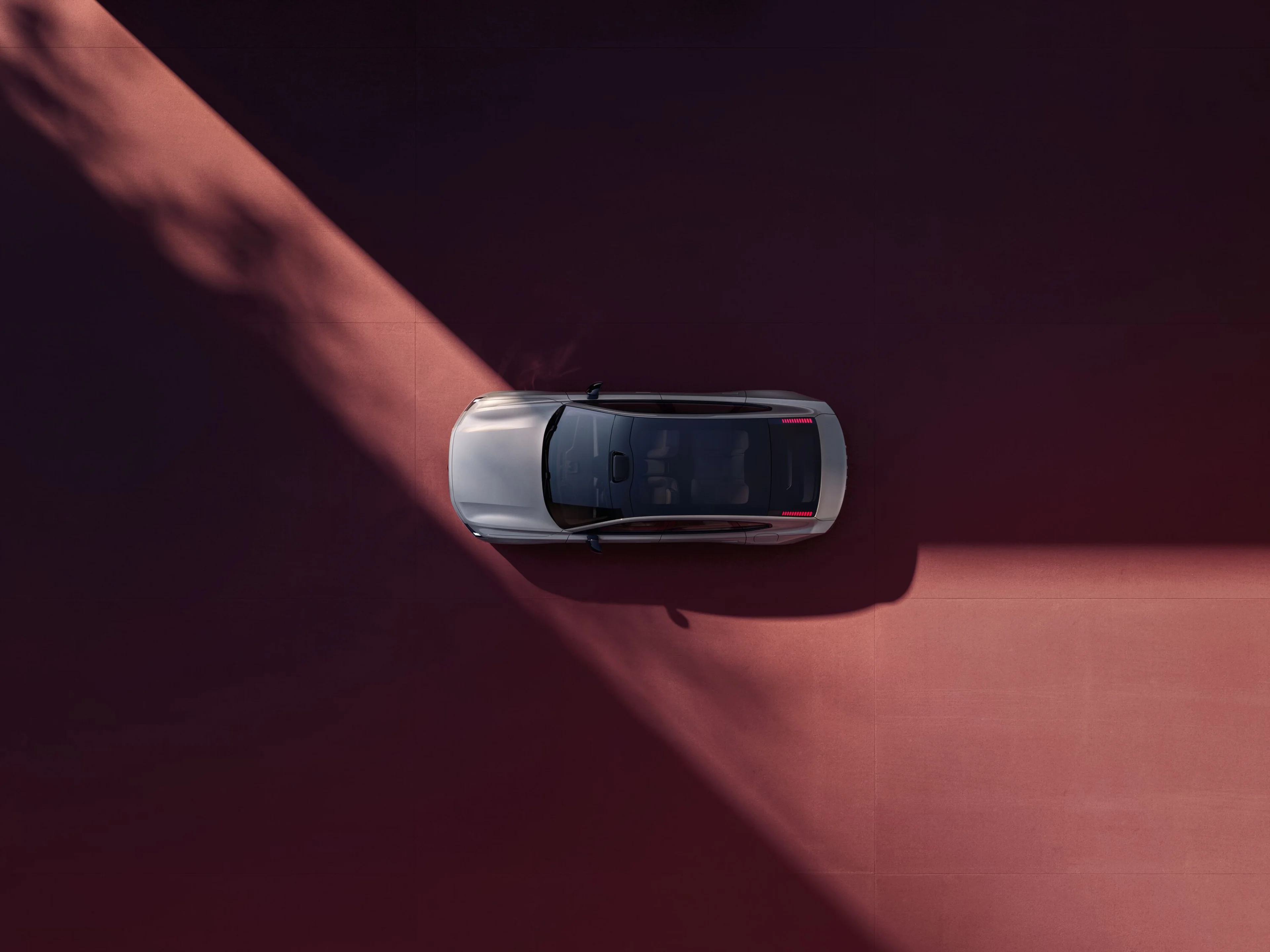 Side profile image of the New Volvo ES90 in aurora silver.
