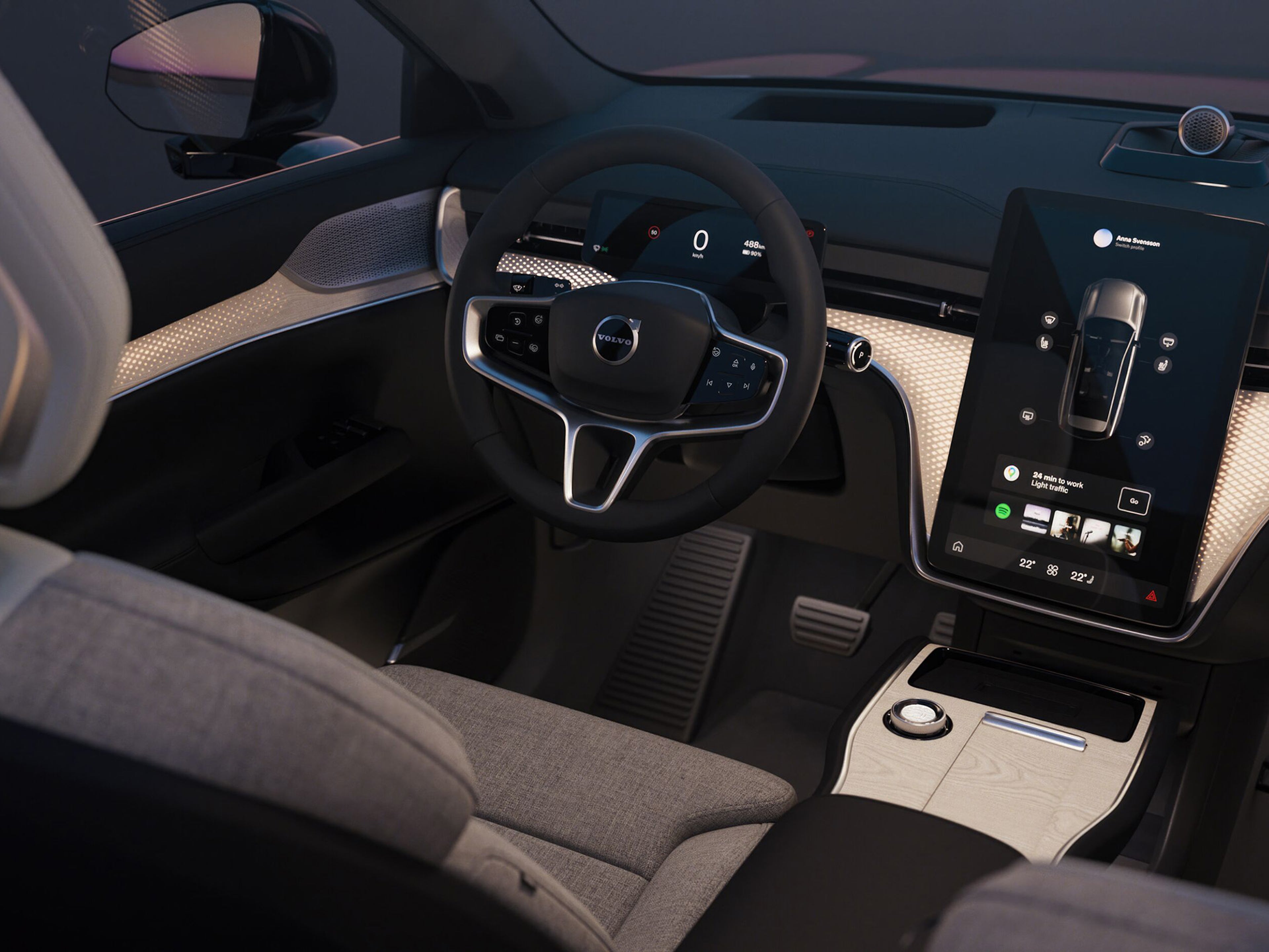 Vista interior do interior do EX90 a incidir sobre o volante e ecrã central.