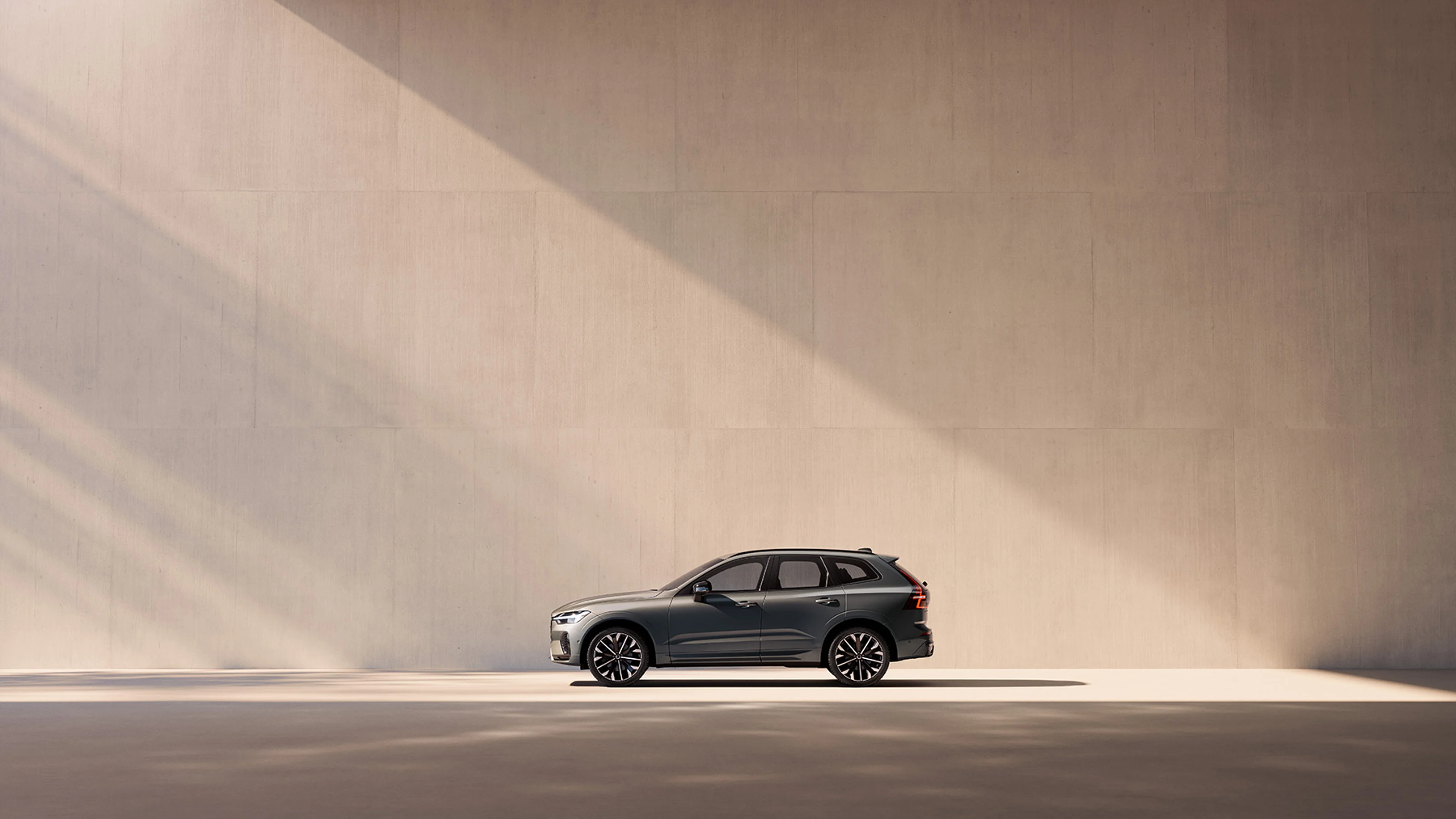 XC60 side view against pastel wall background