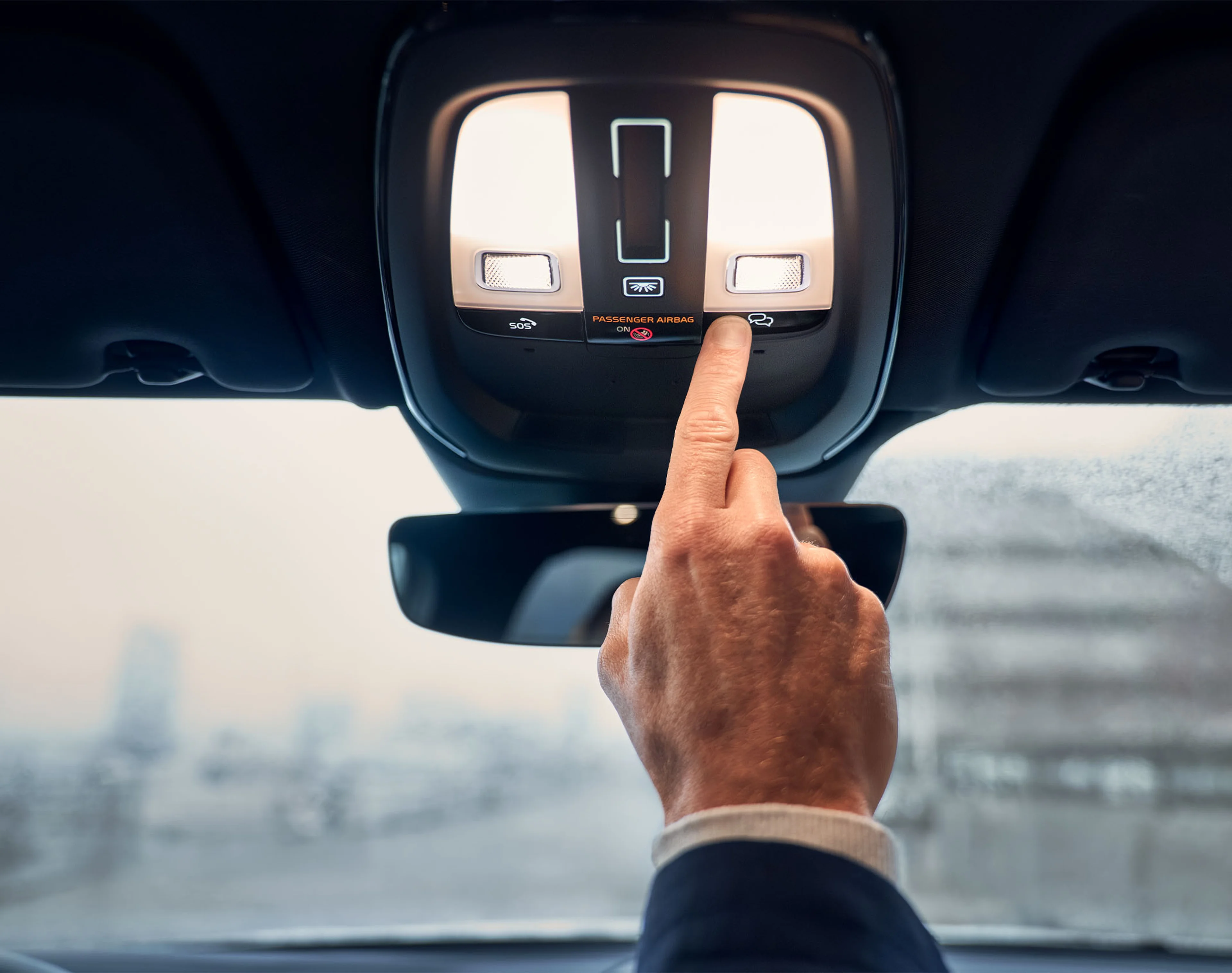Volvo Roadside Assistance - pressing button in overhead console