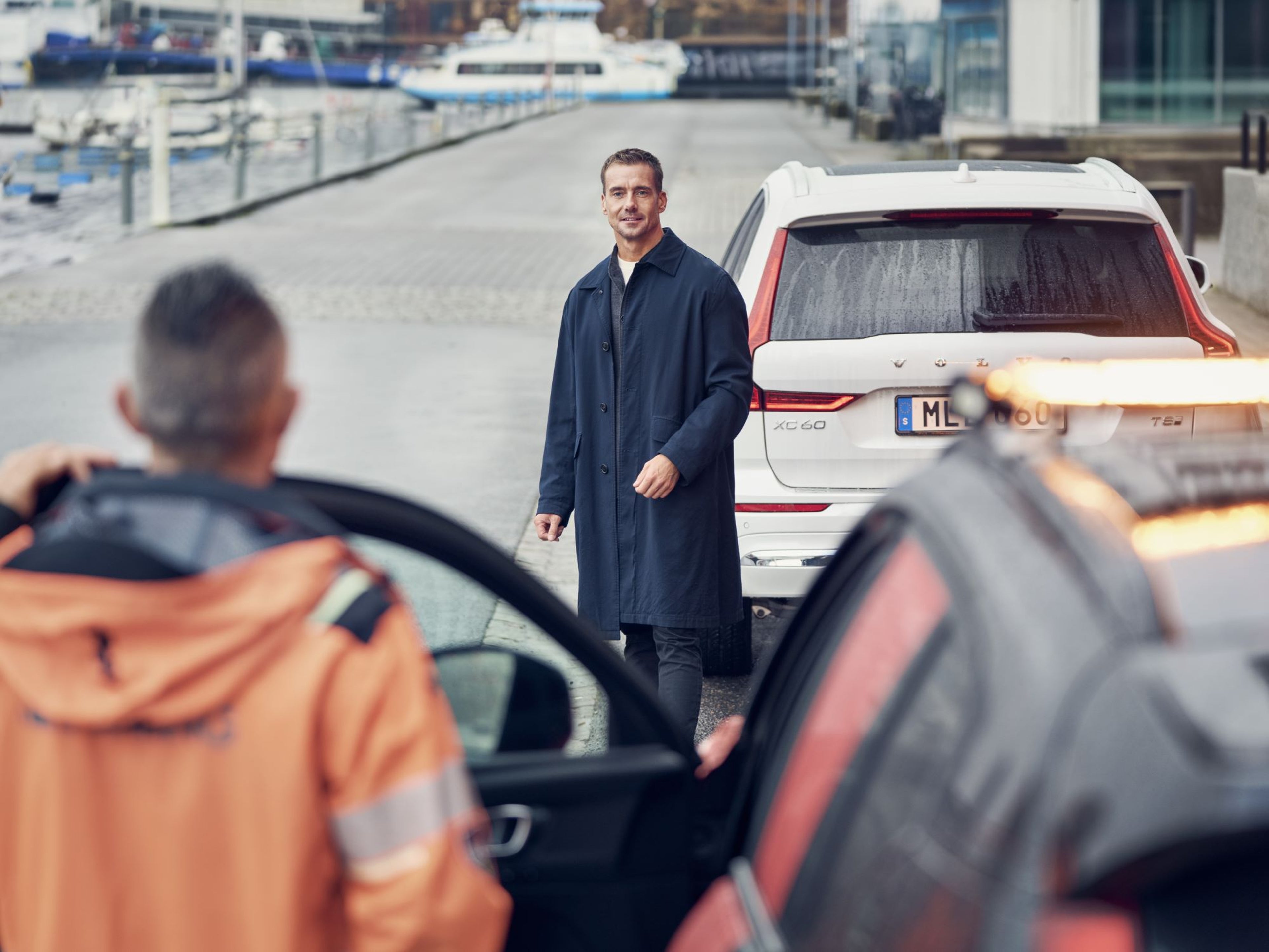 Roadside assistance helping Volvo owner