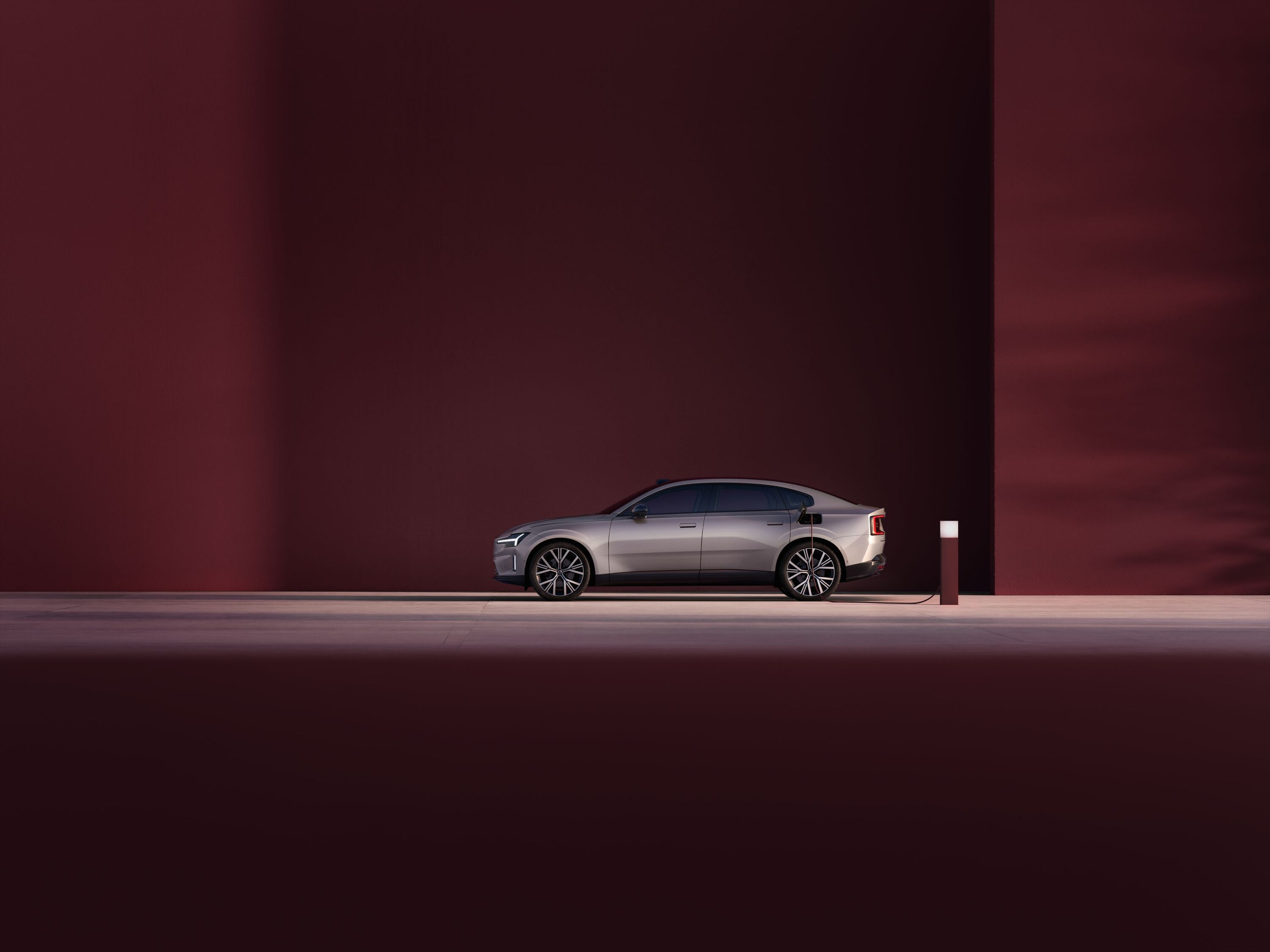 A side profile image of the Volvo ES90 in aurora silver.