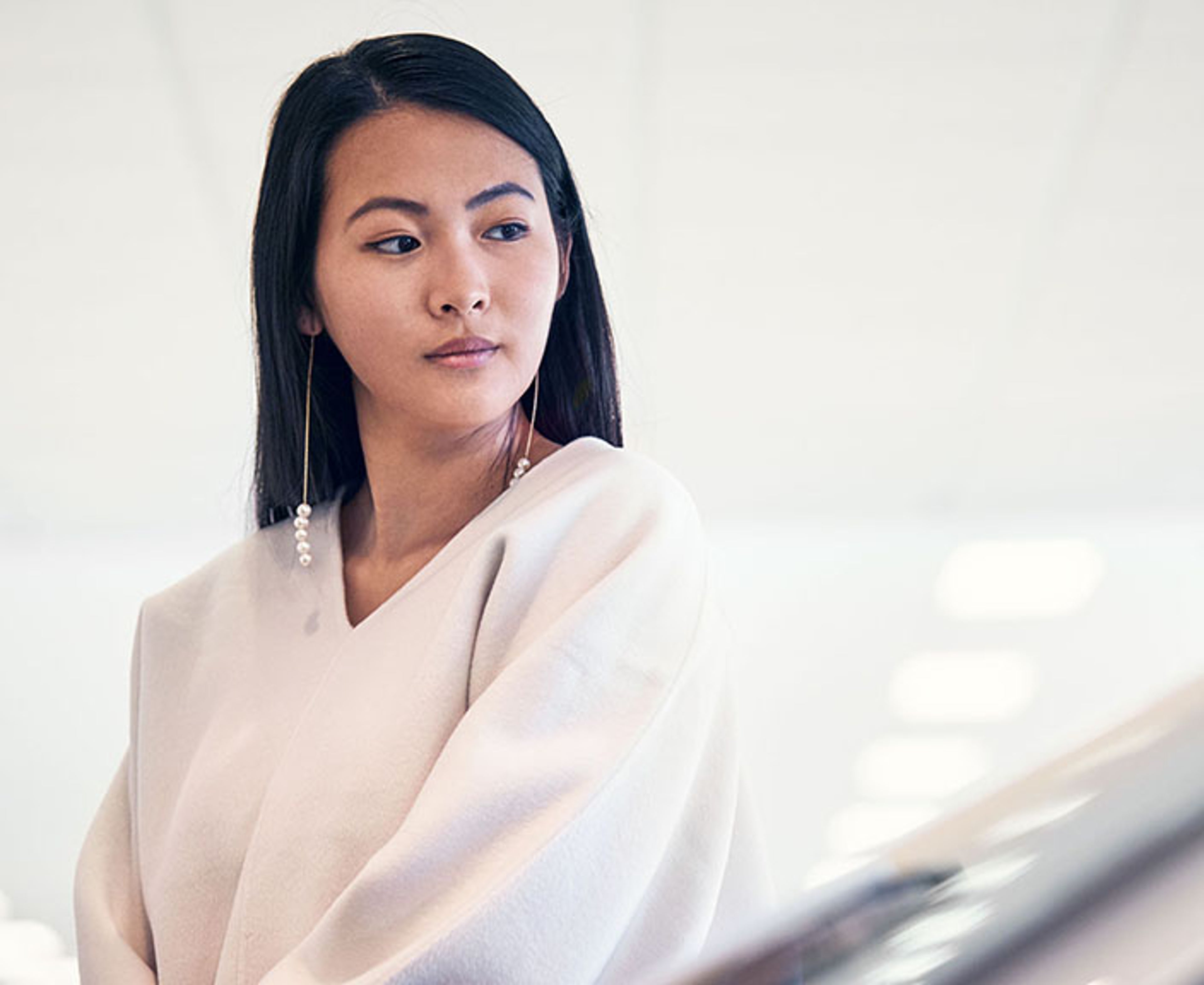 Women looks at Volvo in showroom