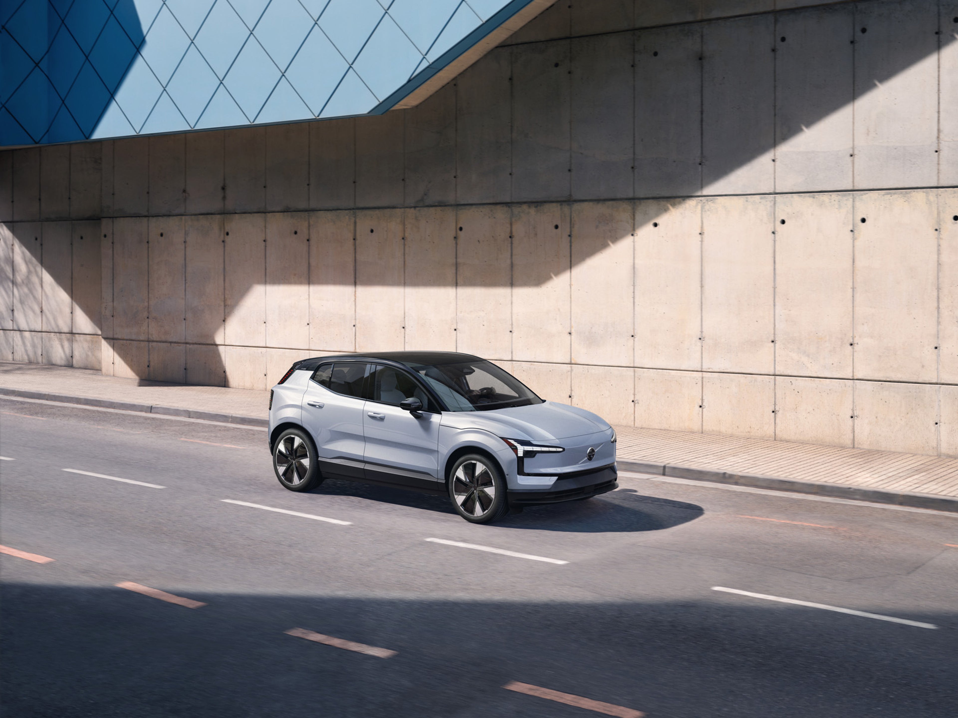 Award-winning Cloud Blue Volvo EX30 fully electric SUV driving