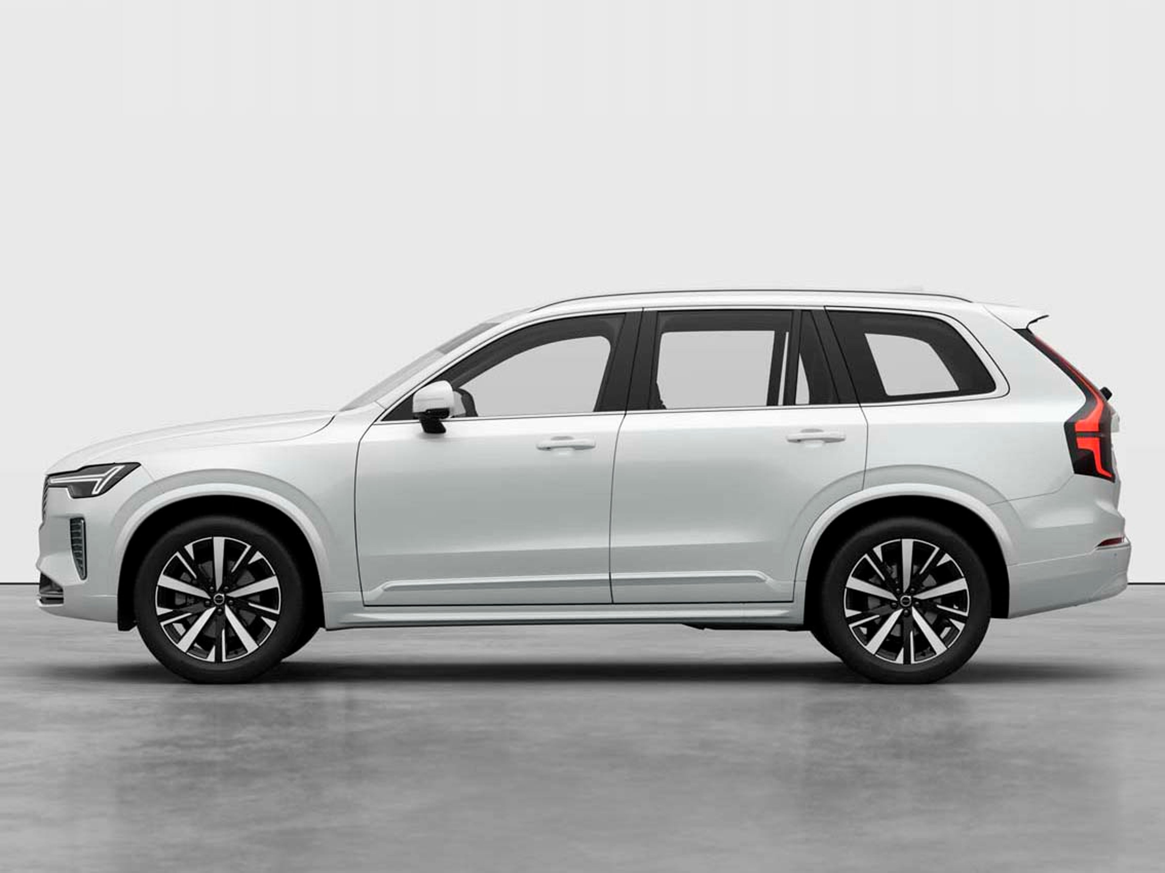 Un vehículo Volvo XC90 SUV color blanco vista lateral