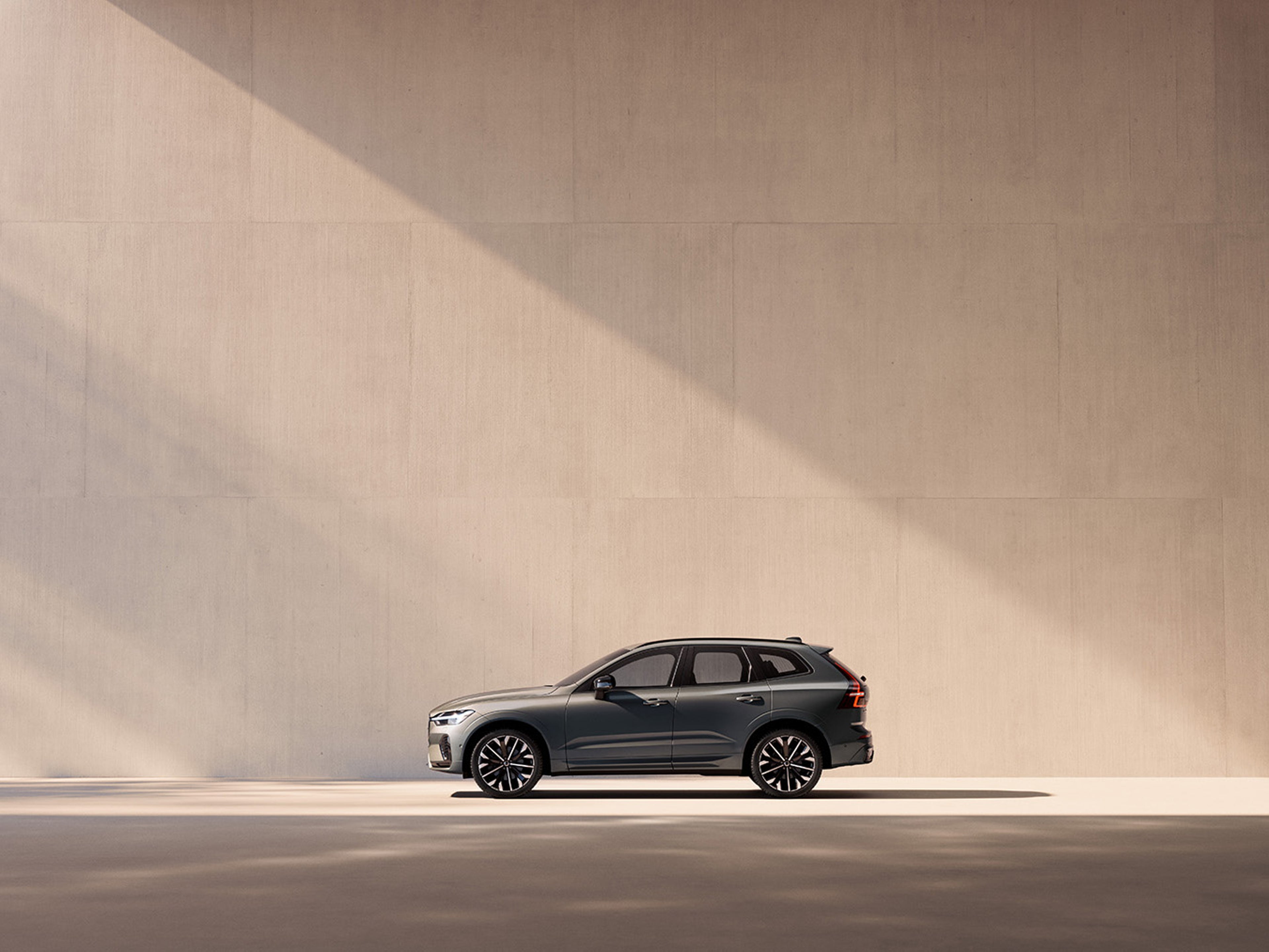 XC60 side view against pastel wall background