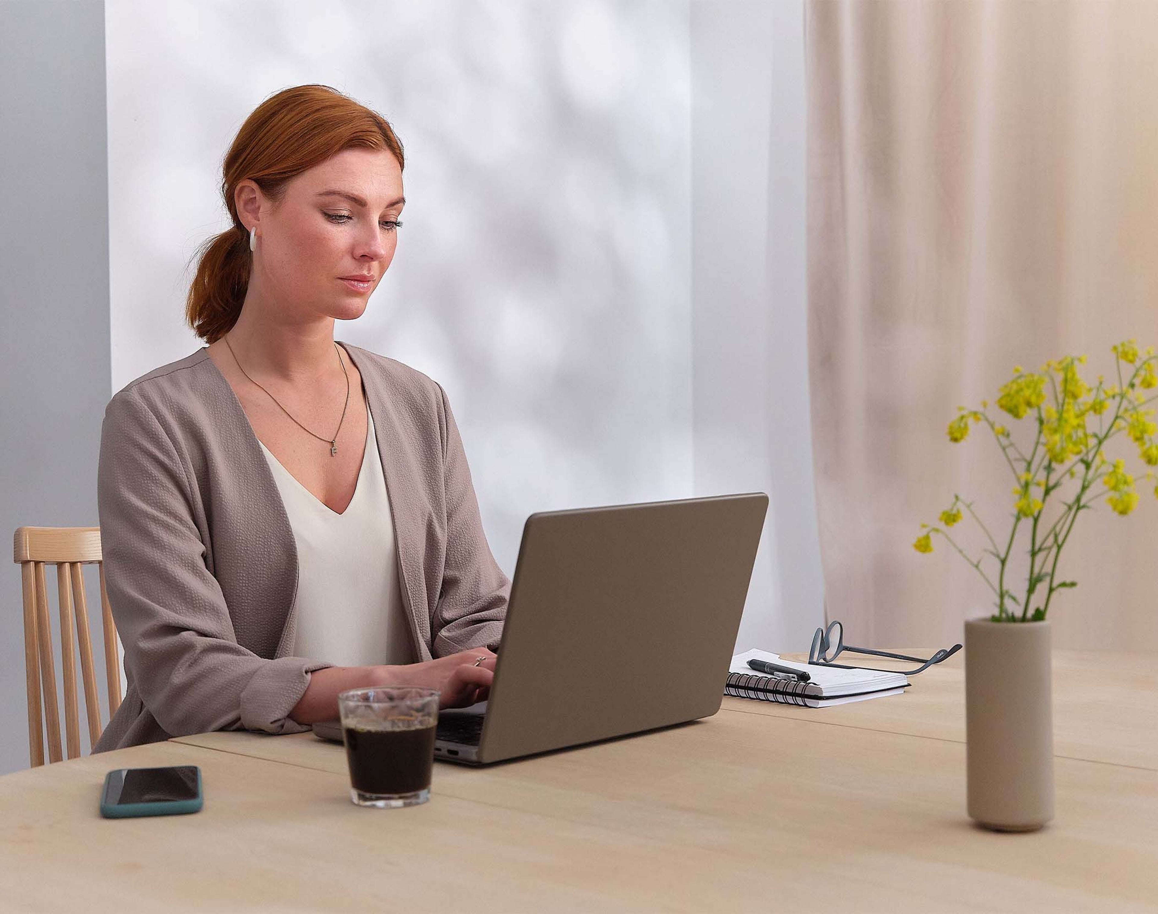 volvo at home - woman using laptop