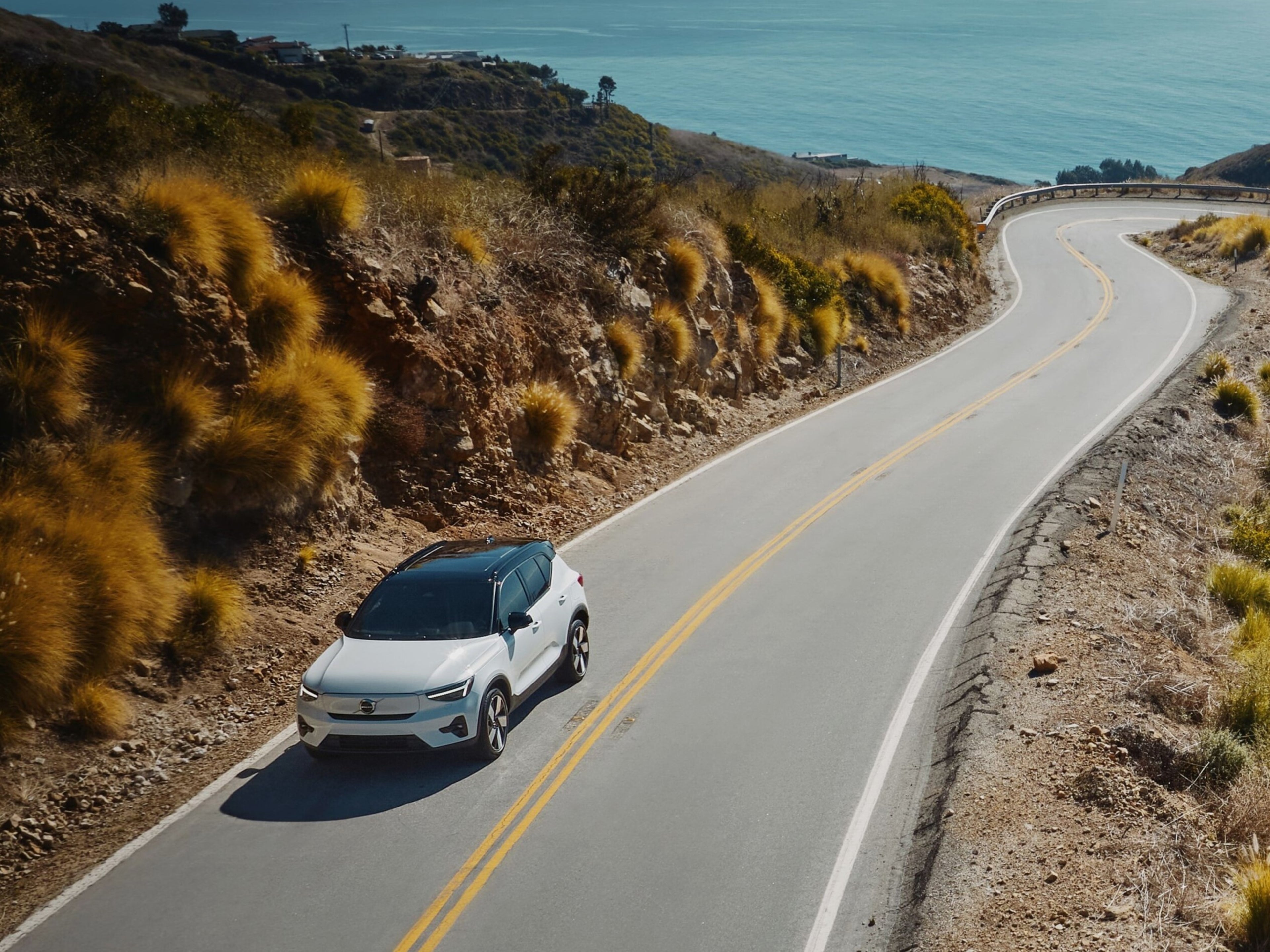 Volvo driving on scenic road