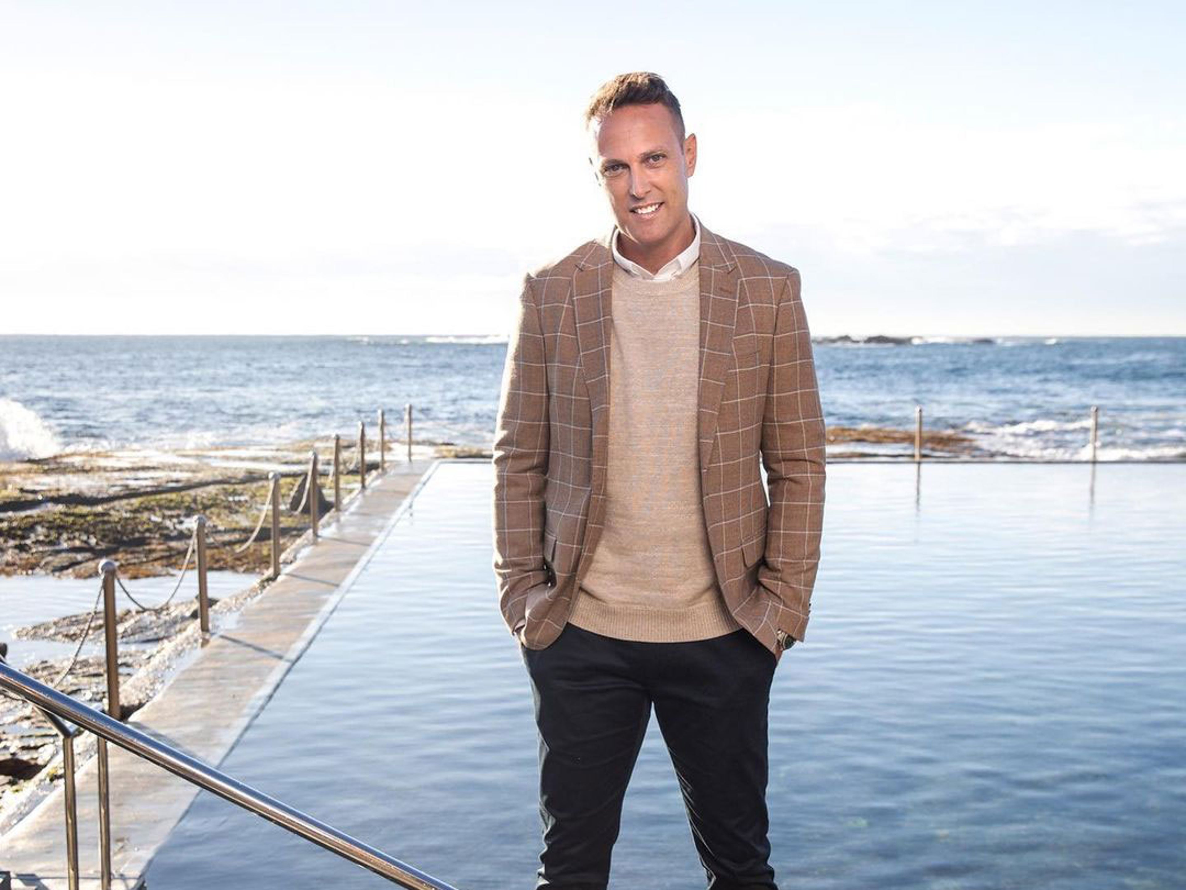 Matt standing in front of infinity pool