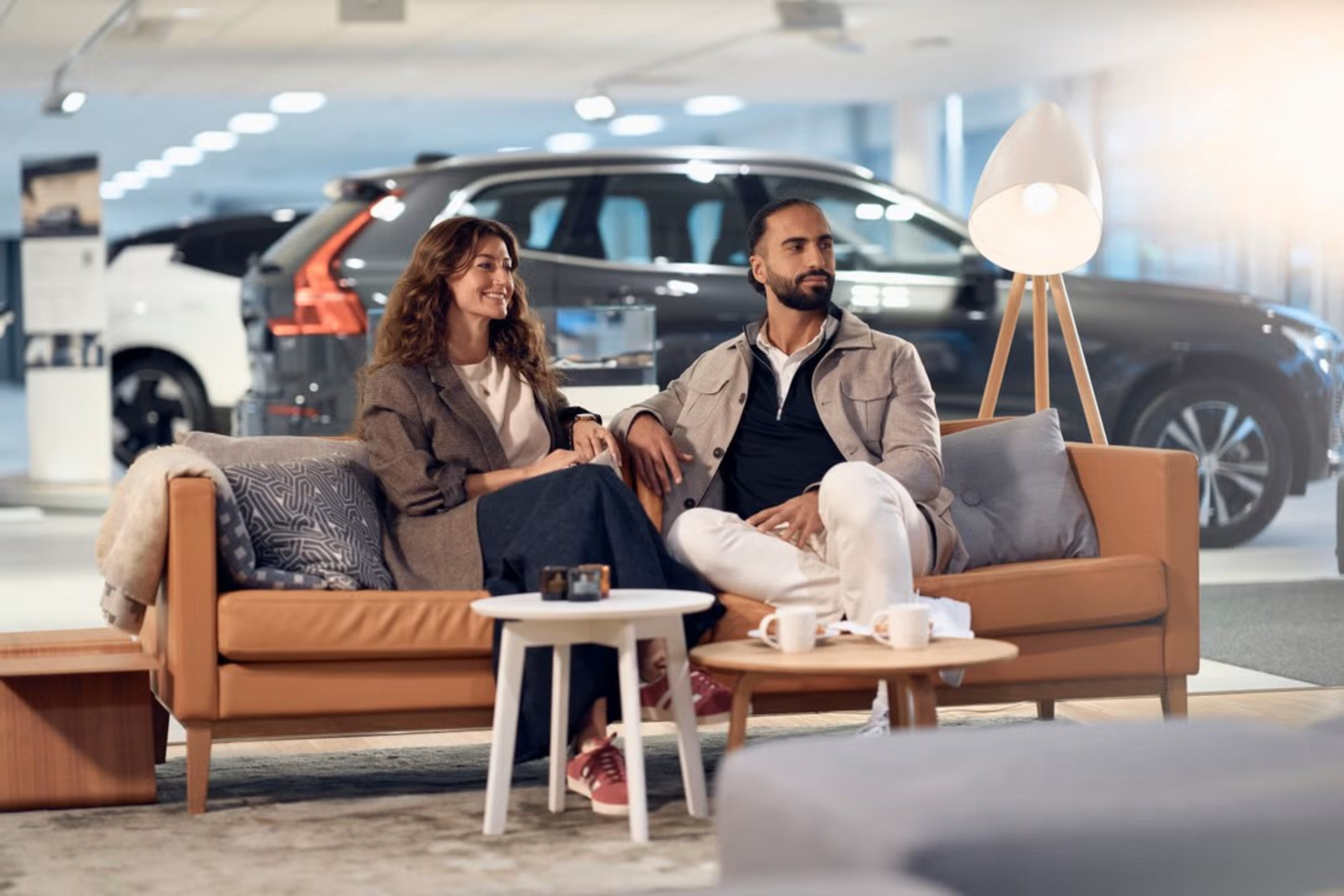 People sitting in Volvo workshop waiting for car to be serviced