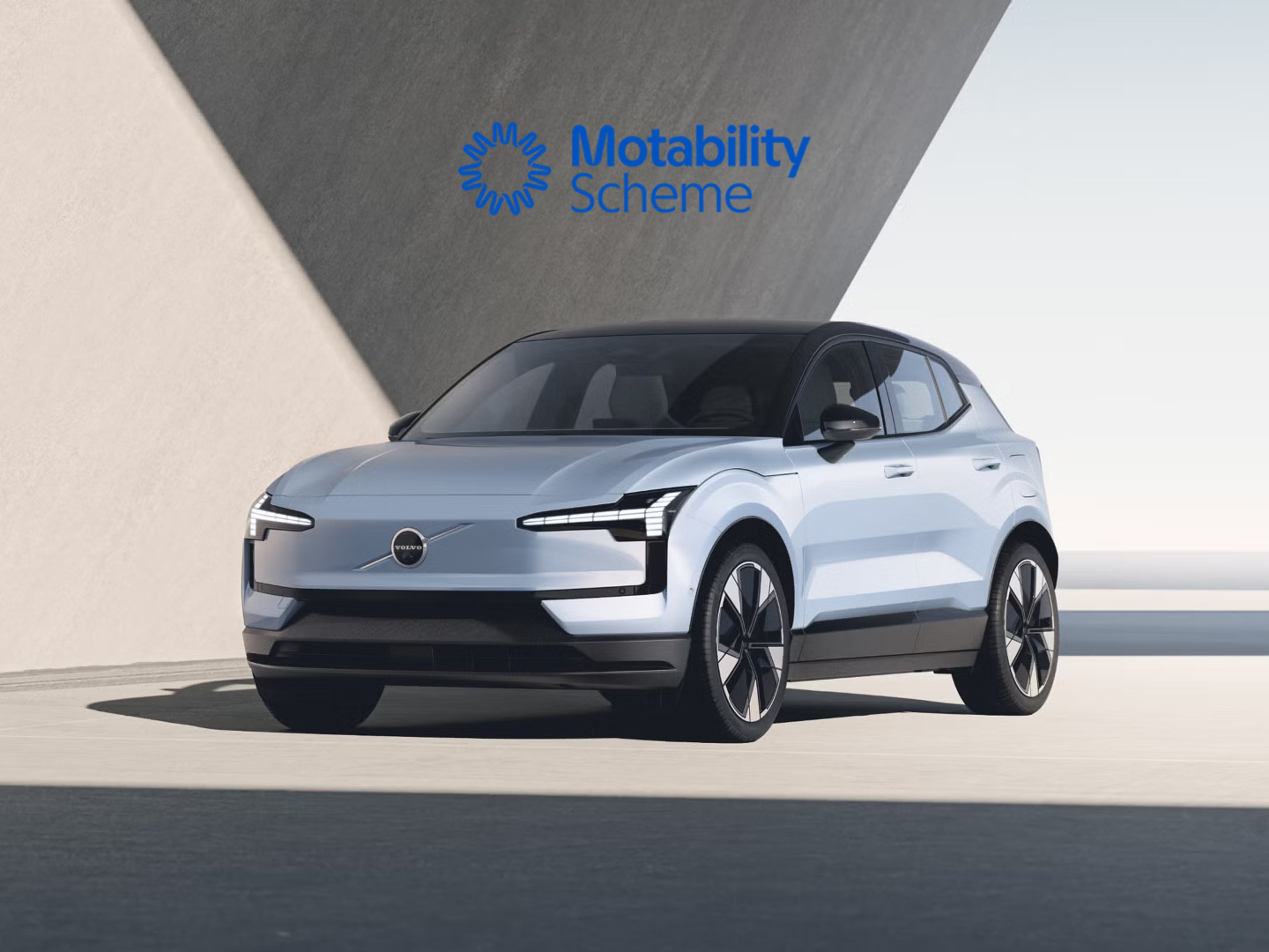 EX30 parked in front of angular background, bathed in daylight