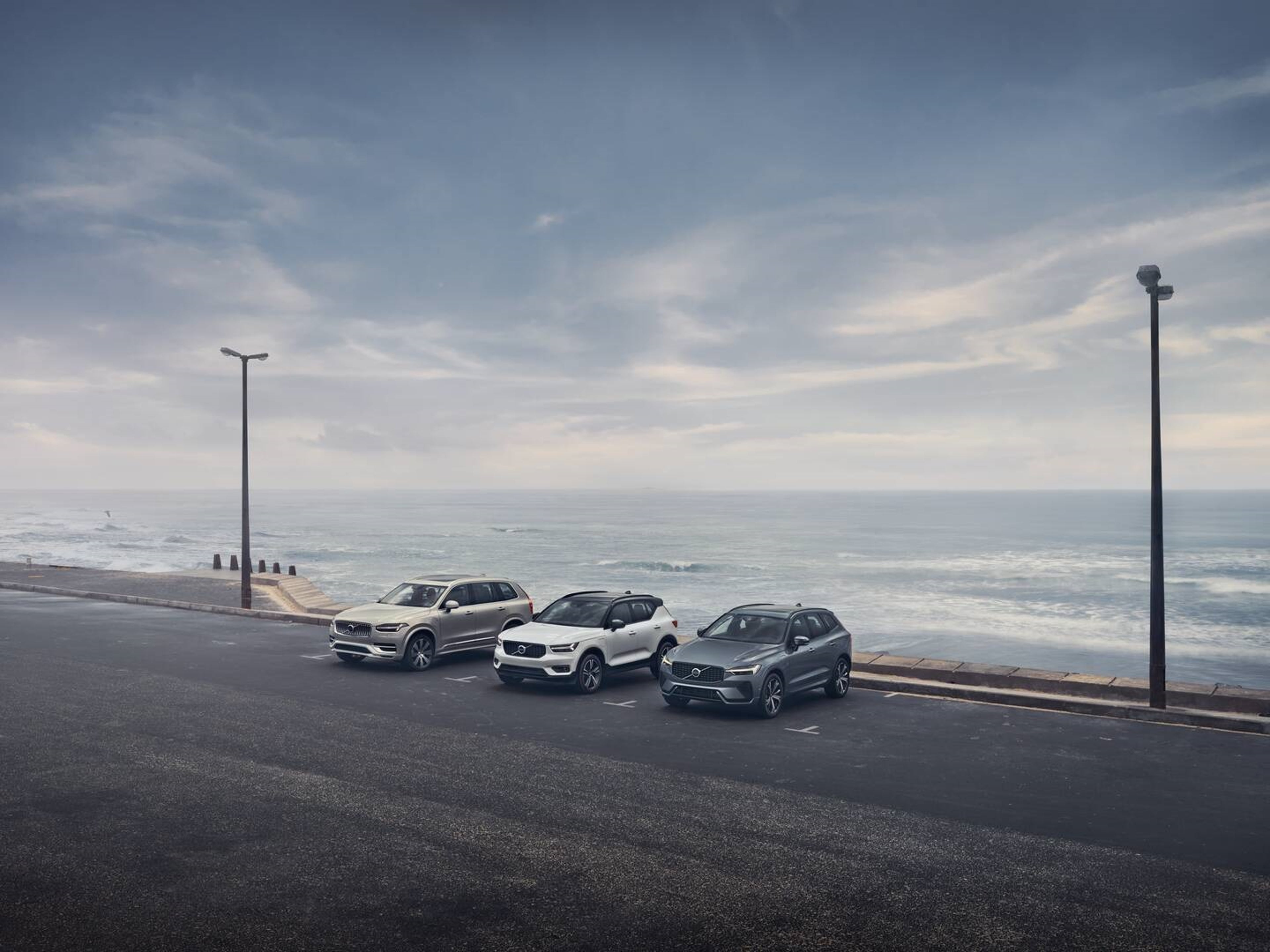 Volvo XC40, XC60 and XC90 parked in a row by the seafront
