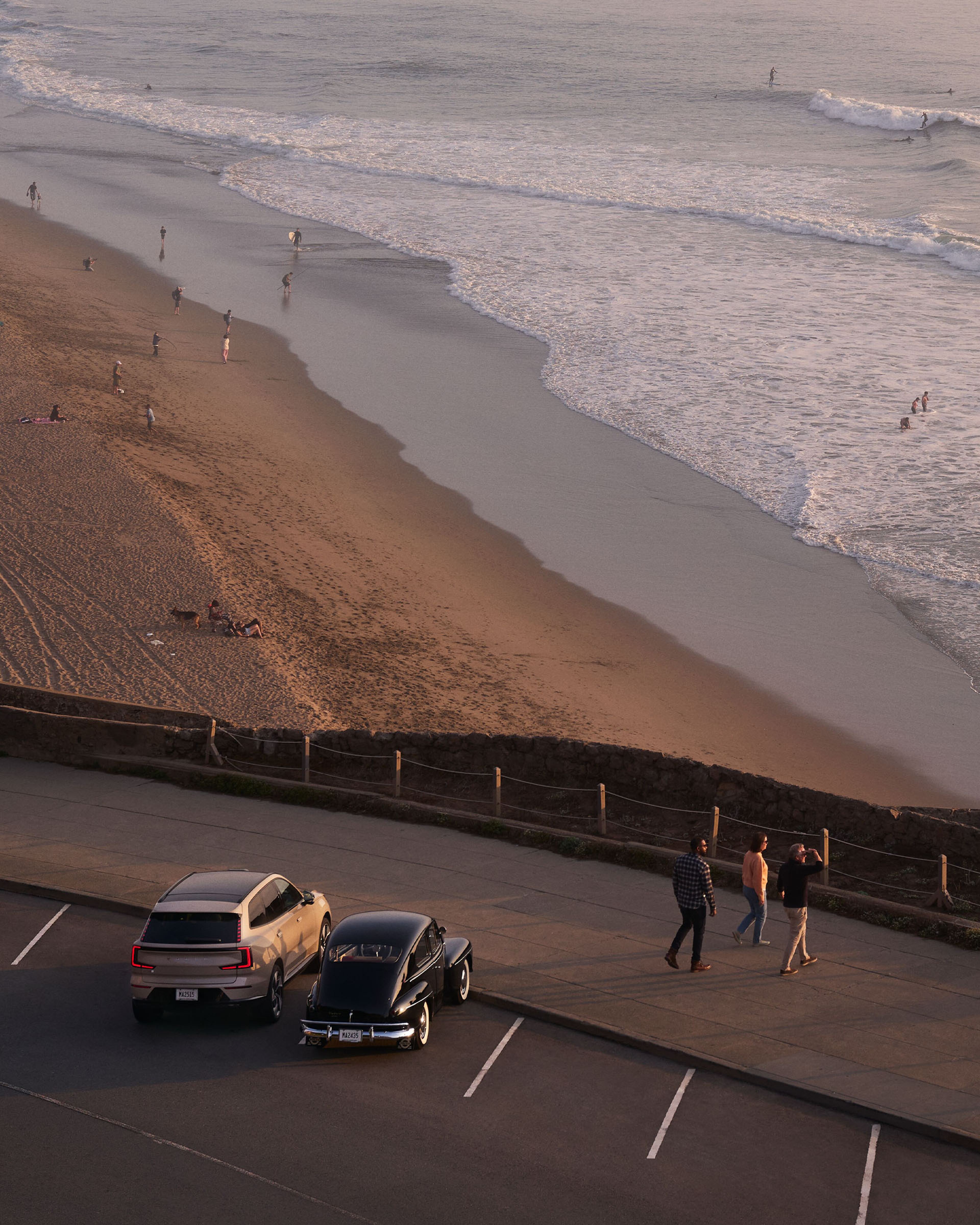 Volvo EX90 and Classic PV444 overlooking scenic beach
